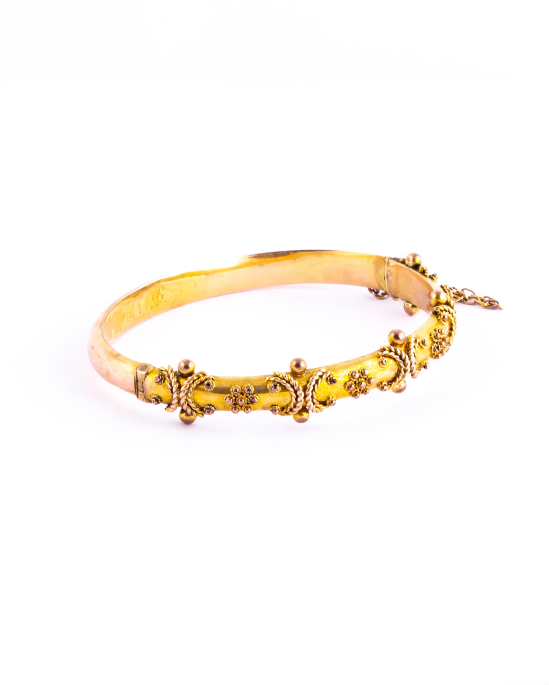 The 9 carat gold is bright and the bangle has so much detail. It holds so much detail with rope twists and orbs. The inside of the bangle has the original owners initials reading 'J.R.B' and is fully hallmarked. Made in Birmingham, England. 

Inner