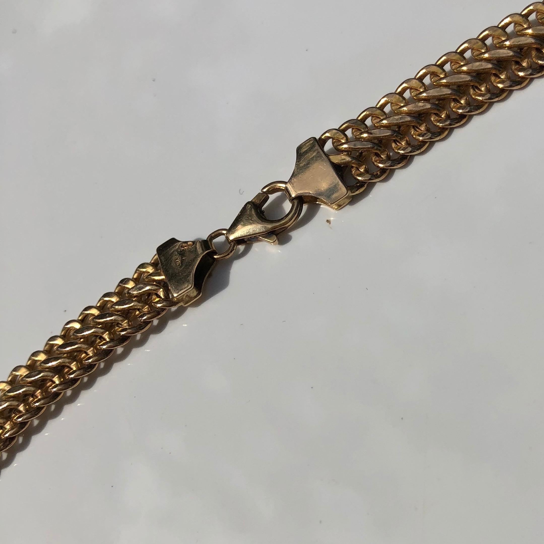 This beautiful 9ct gold collar is flat and sits beautifully. The chain has a snake like feel and was made in Italy. 

Length: 44.5cm
Chain Width: 8mm 

Weight: 13.49g