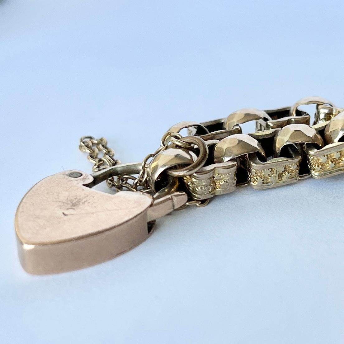 This gorgeous bracelet has highly decorative links in it. One of the styles resembles the paperclip link and the other is a faceted belcher link. There is a heart padlock as the fastening. 

Length: 21.5cm 
Width: 7.5mm 

Weight: 18.2g