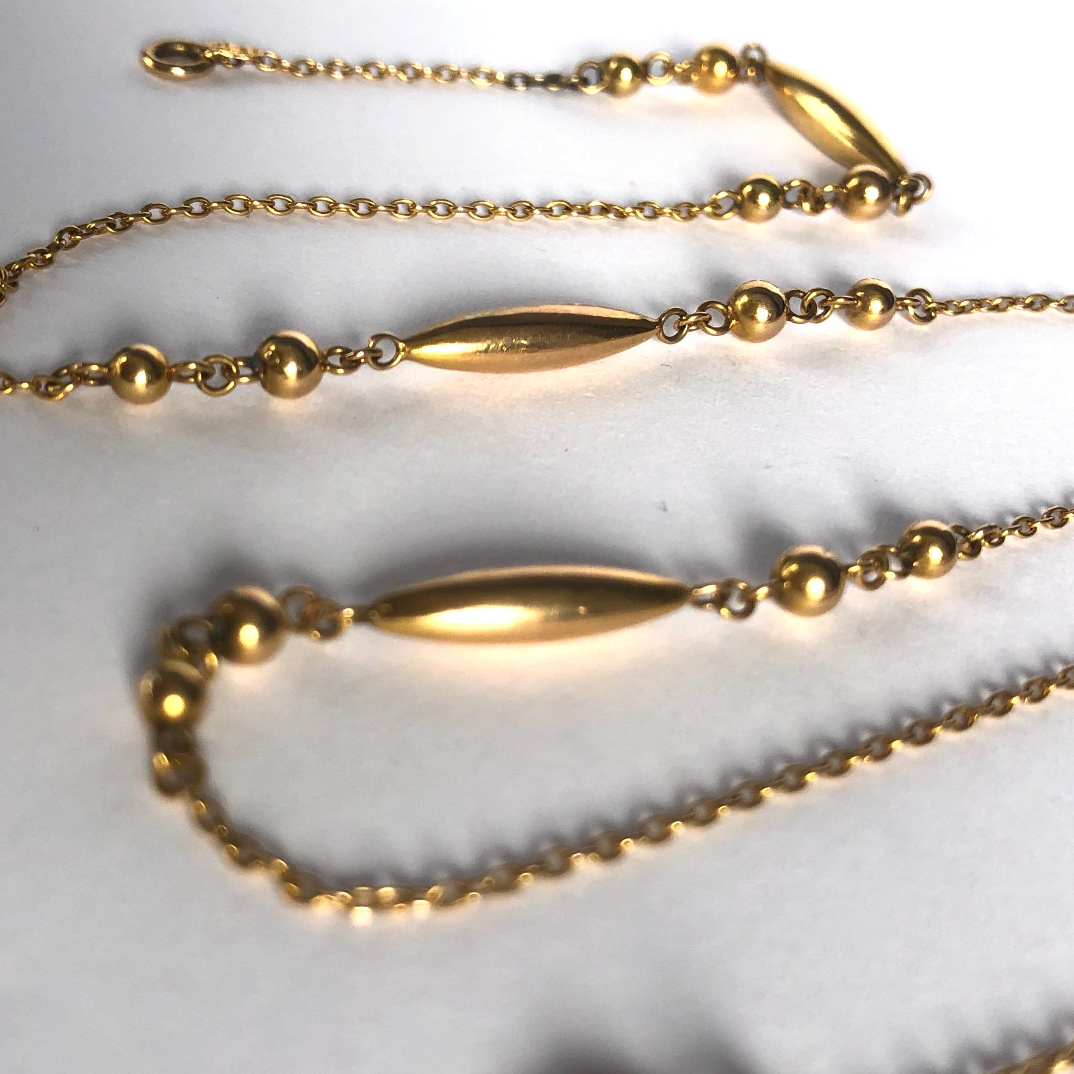 This 9ct yellow gold necklace is made up of slim oval links and gold orbs. The chain fastens using a bolt clasp and has a delicate and stylish feel. 

Length: 39cm 
Width: 2mm 

Weight: 3.46g