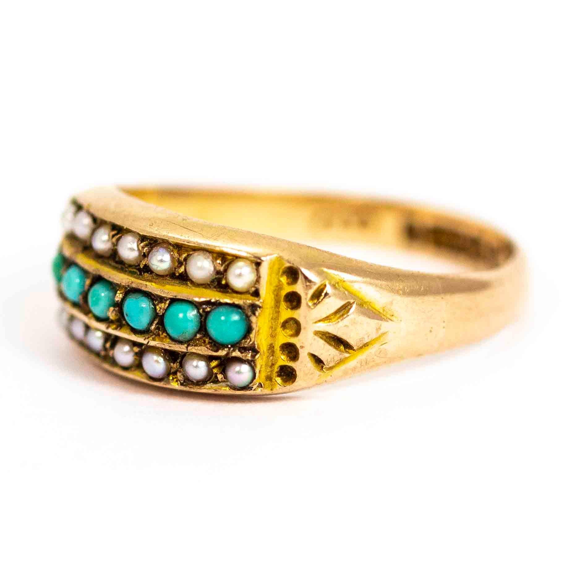 A wonderful antique Victorian ring set with three bands of stunning stones. A band of six beautiful turquoise cabochons is set between two bands of seven seed pearls. The shoulders are set with great hand-chased detailing. The inscription on the