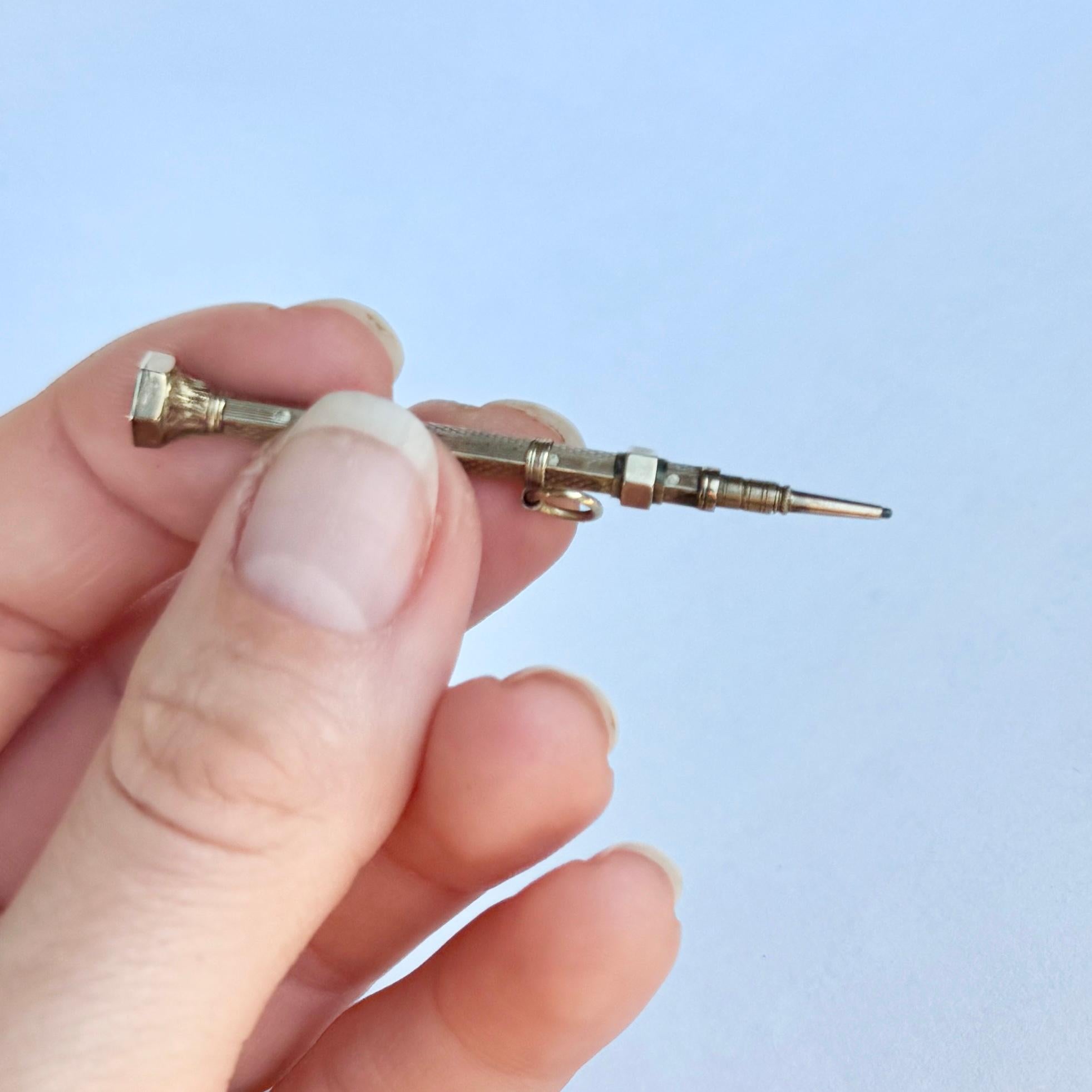 This victorian pendant is a pencil and has the original lead inside still. It has a foiled crystal end as you can see in the images. 

Pencil length: 5cm

Weight: 1.9g 