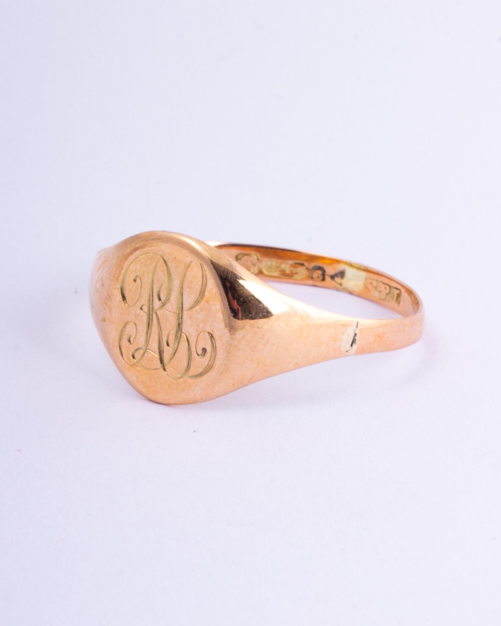 The fluid scroll font which reads 'RL' is finely engraved onto the face of this ring. The shoulders are smooth and carry on down into a plain band modelled in 9ct gold. 

RIng Size: T or 9 1/2
Widest Part: 11mm 

Weight: 1.1g