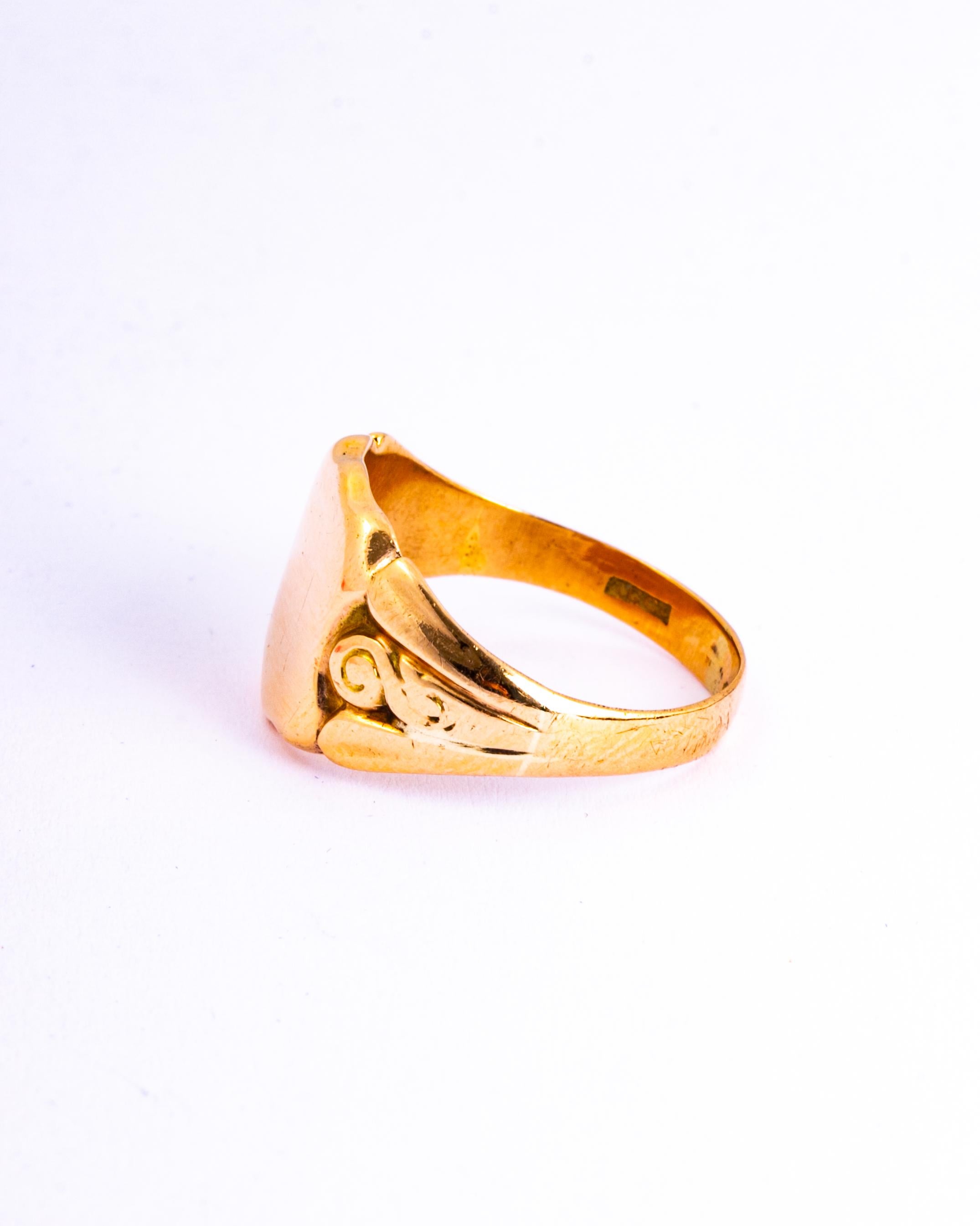 The face of this ring is a large glossy shied shape. The chunky shoulders are have scroll detail and carry on down into a plain band modelled in 9ct gold. 

RIng Size: Q or 8 1/4
Widest Part: 13mm 

Weight: 4.8g