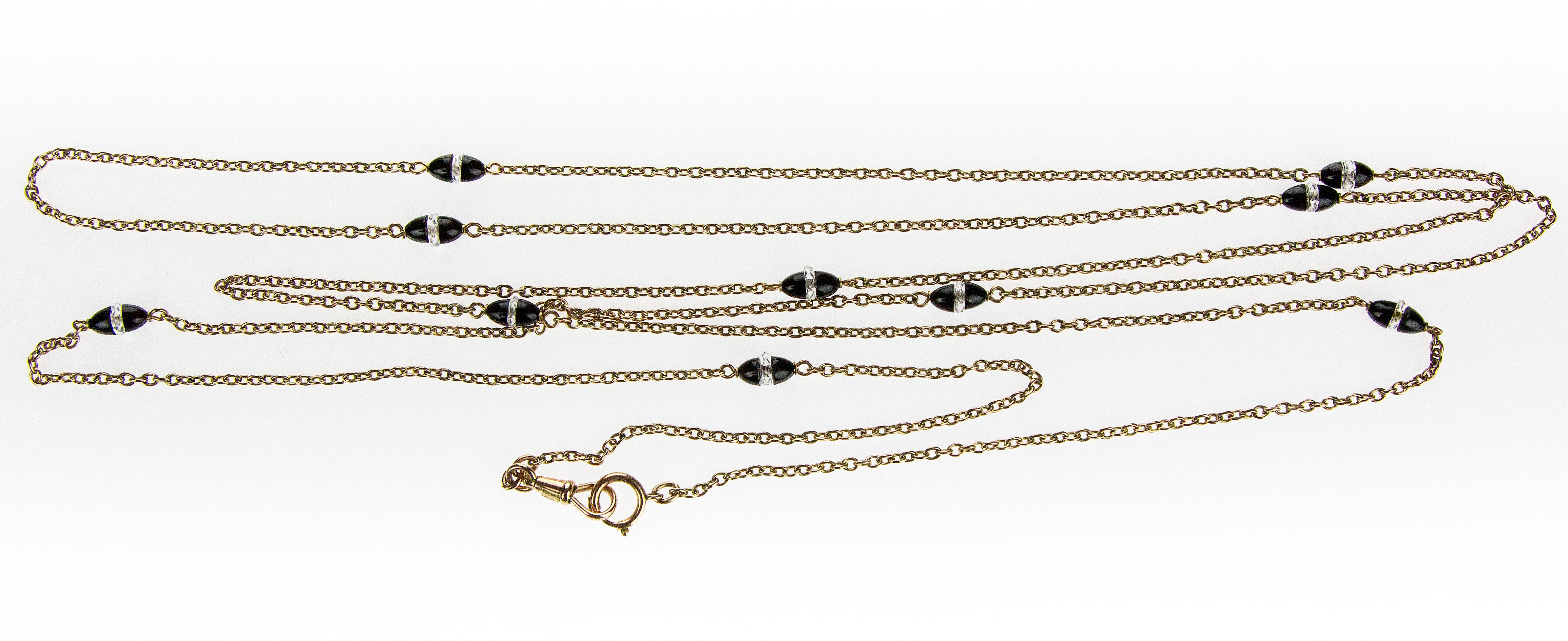 Victorian 9 ct Rose Gold Trace Link Guard Chain Necklace with Onyx and Rock Crystal Beads
Popular in the early 19th century, the guard chain was commonly used to suspend everyday commodities such as keys to the cellar, pocket or pendant watches,