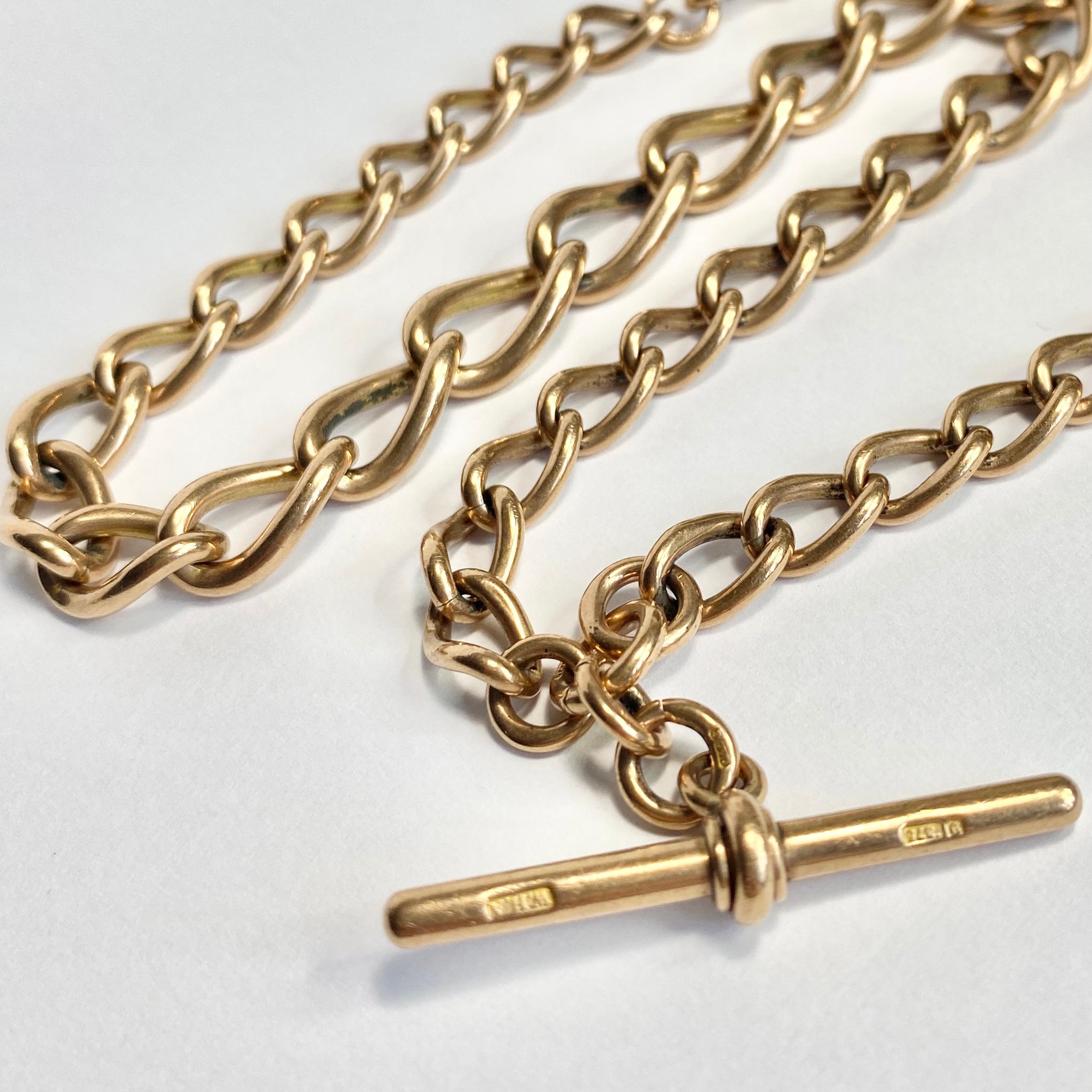 This chunky albert chain is made up of large links and can be worn as a necklace. On one end there is a dog clip and the other holds a spinning fob set with sardonyx and bloodstone. Modelled in 9ct rose gold. 

Length inc fob: 39.5cm 
Chain Width:
