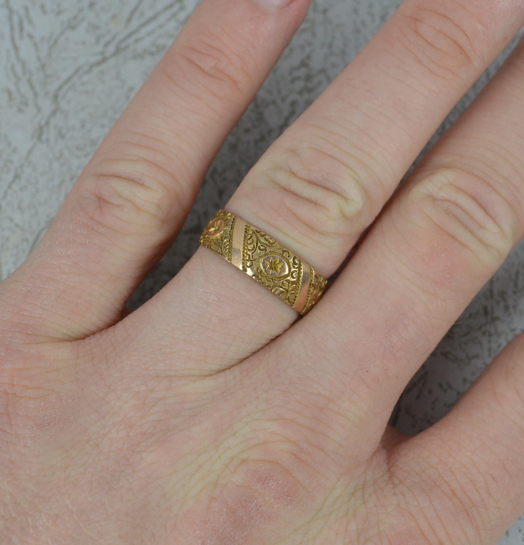 A superb early Victorian band ring.
Solid 9 carat rose gold example.
6mm wide throughout.
A full eternity engraved band throughout. 

CONDITION ; Very good for age. Very crisp pattern and hallmarks. Please view photographs.

WEIGHT ; 2.8 grams
SIZE