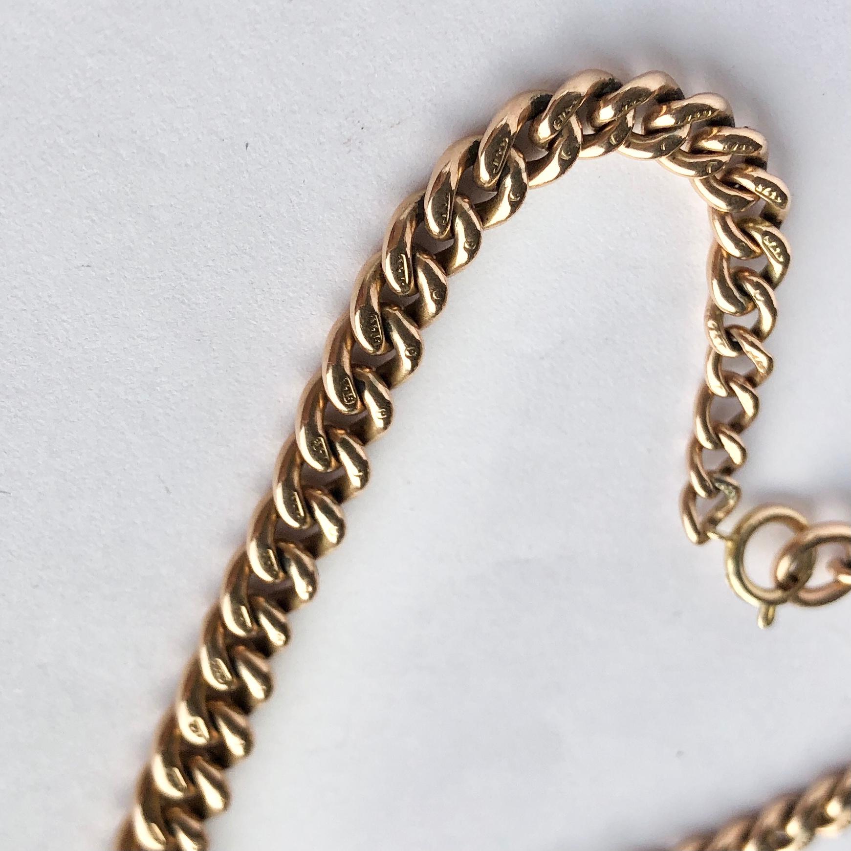 This curb chain bracelet is wider at the centre and slimmer towards the clasp and modelled in glossy 9ct rose gold. The bracelet is fastened by simple bolt clip and loop. Each link is hallmarked. 

Length: 23.5cm
Widest Point: 7mm
Slimmest Point: