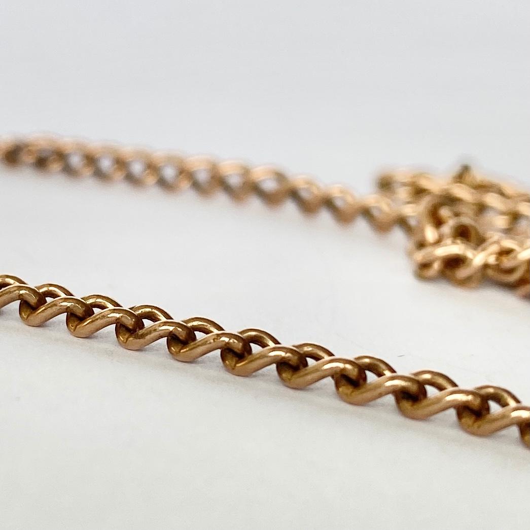 This is a traditional 9ct rose gold double albert chain. The chain features a t-bar and two dog clips. At the end of the chain is a dog clip to attach a charm or a watch. 

Length: 49.5cm 
Chain Width: 2.5mm 

Weight: 6.8g