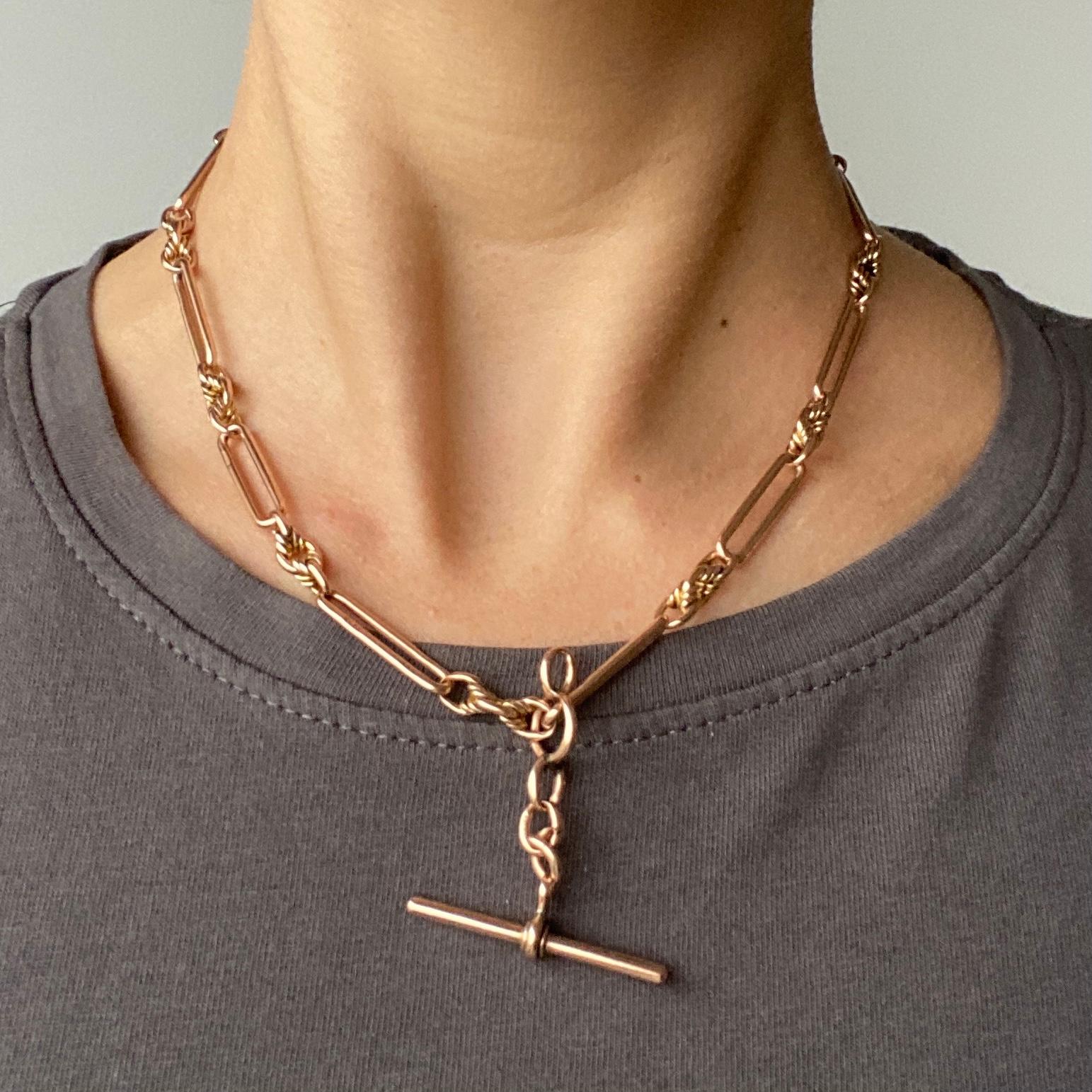 This gorgeous chain  has highly decorative links in it. One of the styles resembles the paperclip link and the other is layered, knotted and twisted. This chain also holds a t-bar, bolt clip and a dog clip. Modelled in 9ct rose gold.

Length: 42cm