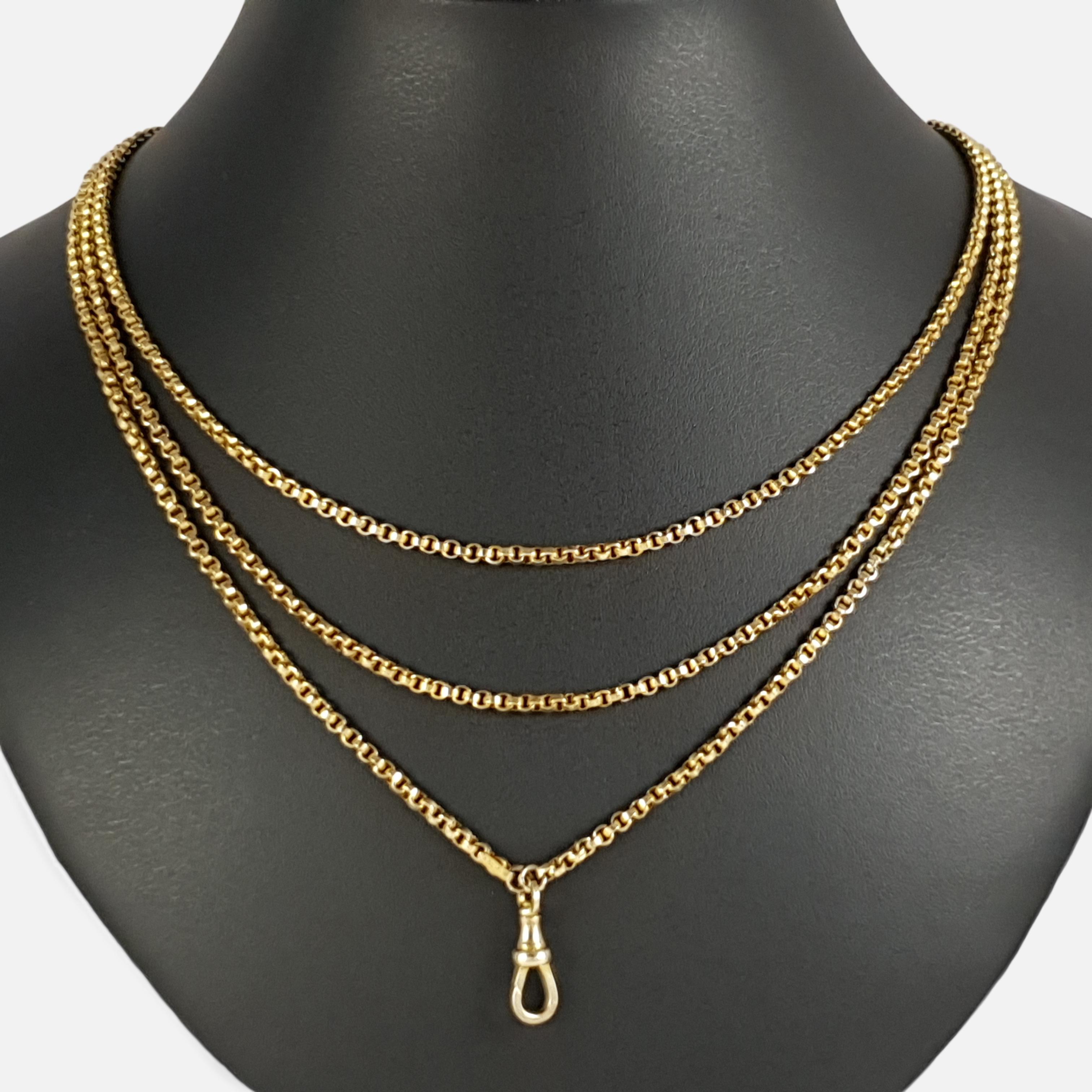 Description: - This is a superb antique Victorian 9 karat yellow gold long guard muff chain with associated dog clip. The chain is tagged '9C J.M'.

Date: - Circa 1890.

Measurement: - The chain measures approximately 60 1/8 inches (152.72cm) in