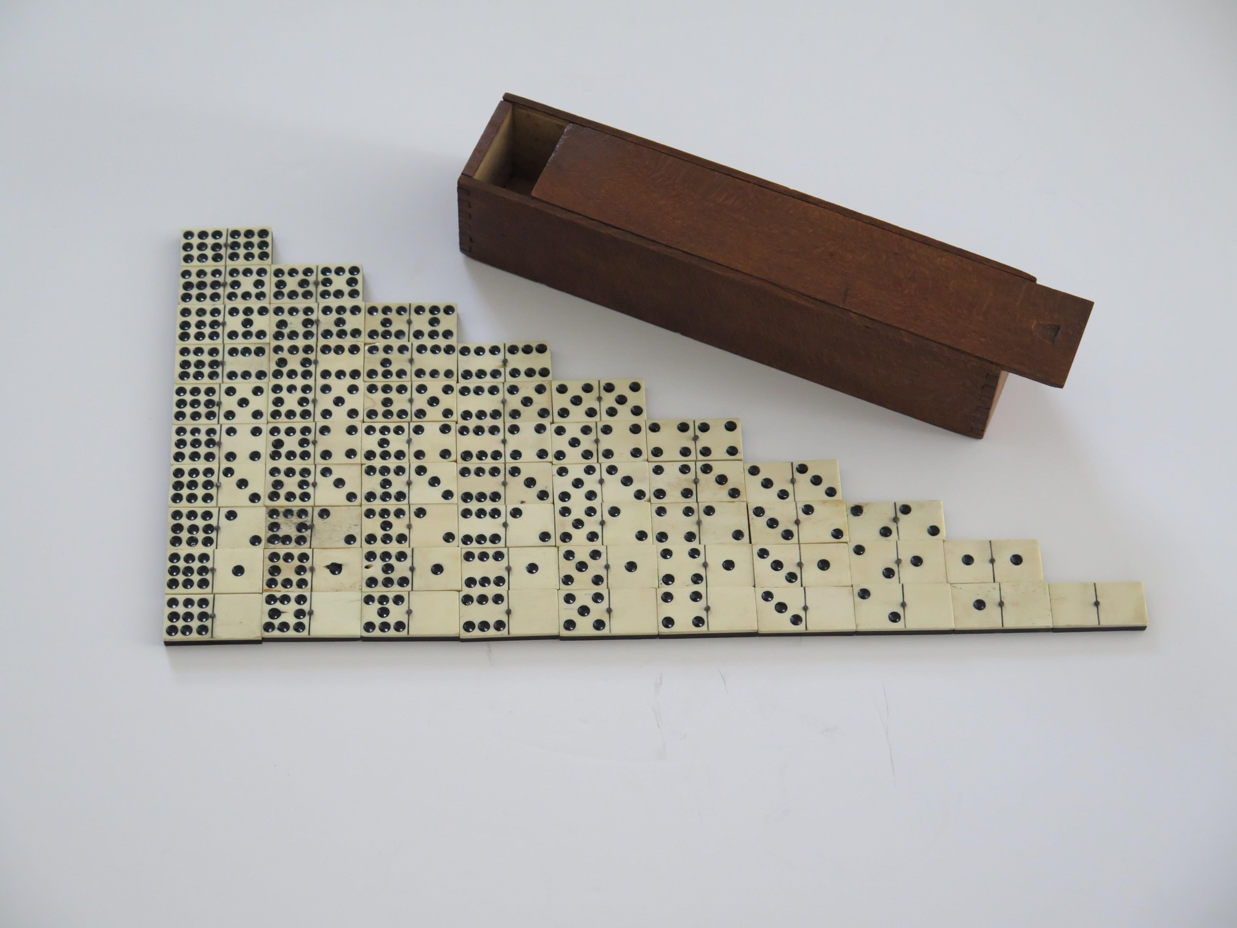 This is a rare and original '9 Spot' Dominoe game of 55 individual dominoes, coming complete with its jointed wooden box or case.

Dominoe sets are normally six-spot sets giving a total of 28 dominoes.
This set is much rarer, having a full nine-spot