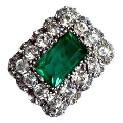 Victorian 900 silver brooch, featuring a green and clear paste stone