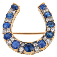 Victorian 9.20 carat sapphire diamond 18k yellow gold silver horseshoe brooch