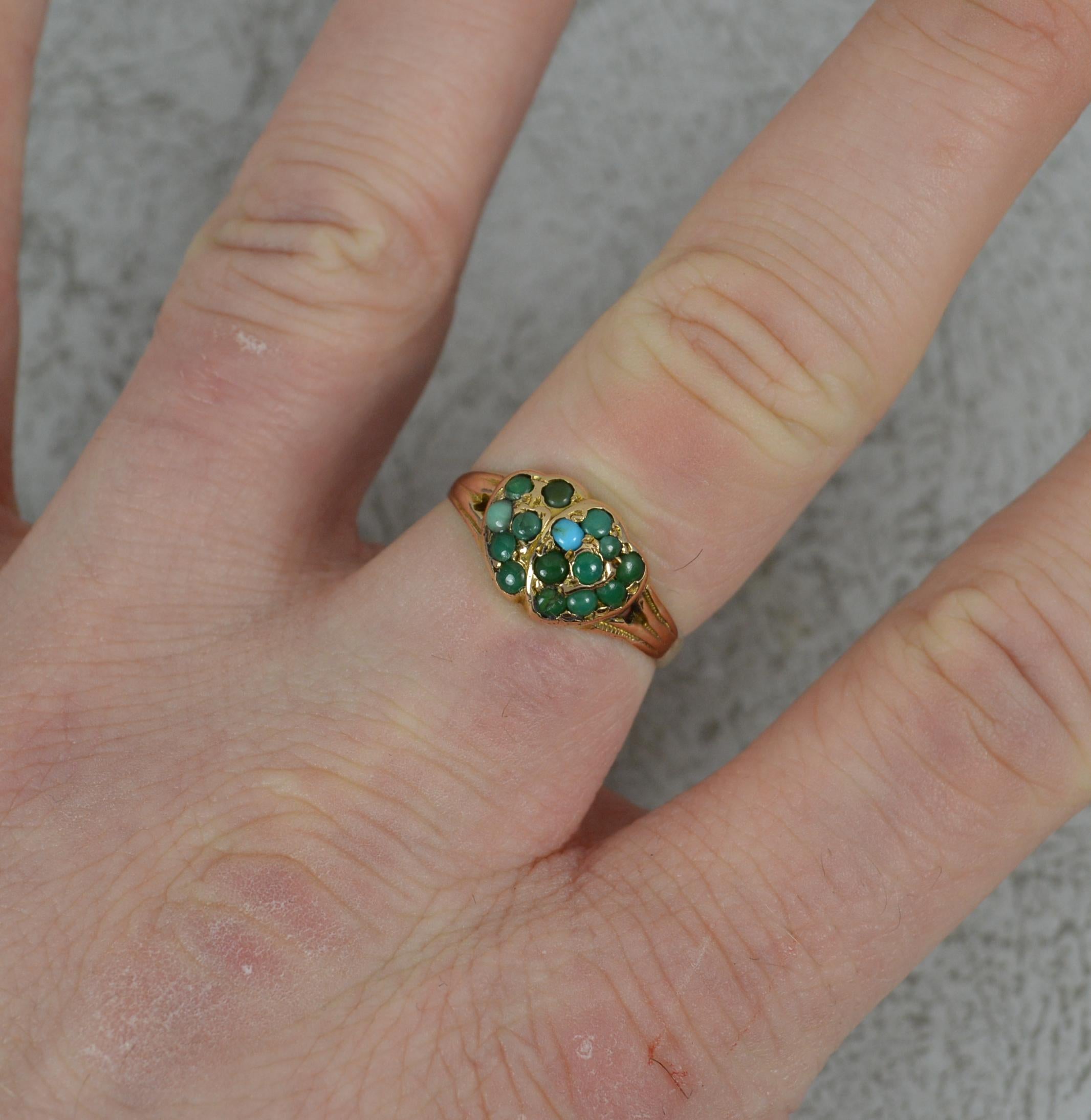 A superb Victorian era ring.
Solid 9 carat gold example.
Two heart design set with turquoise stones.
16mm x 8mm cluster head.

CONDITION ; Excellent. Well set stones. Clean, strong band. Issue free. Please view photographs.
WEIGHT ; 2.3 grams
SIZE ;