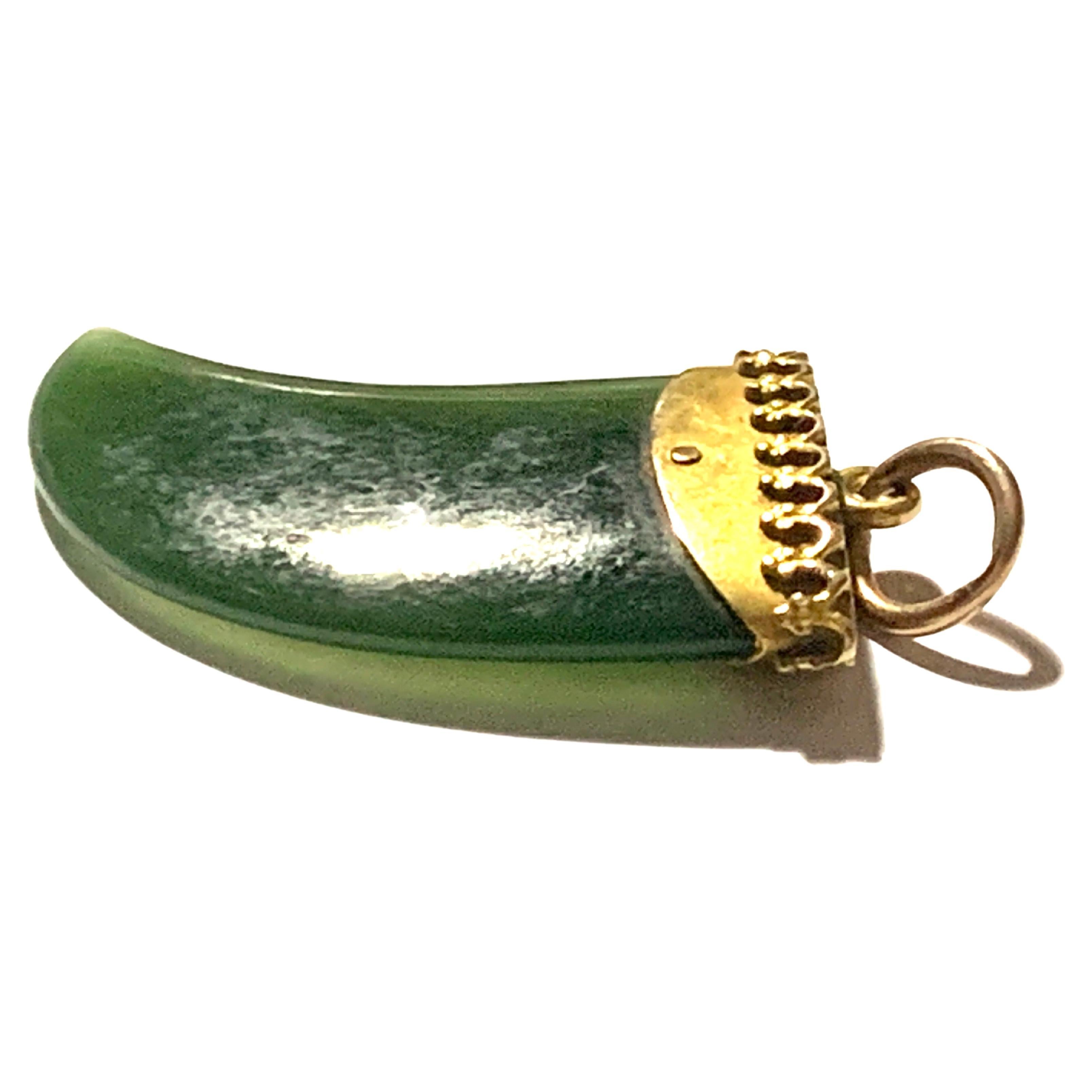 Antique
Victorian Tiger Tooth Shaped Jade Stone Pendant
mounted in 9ct Gold 
Stamped 9ct 