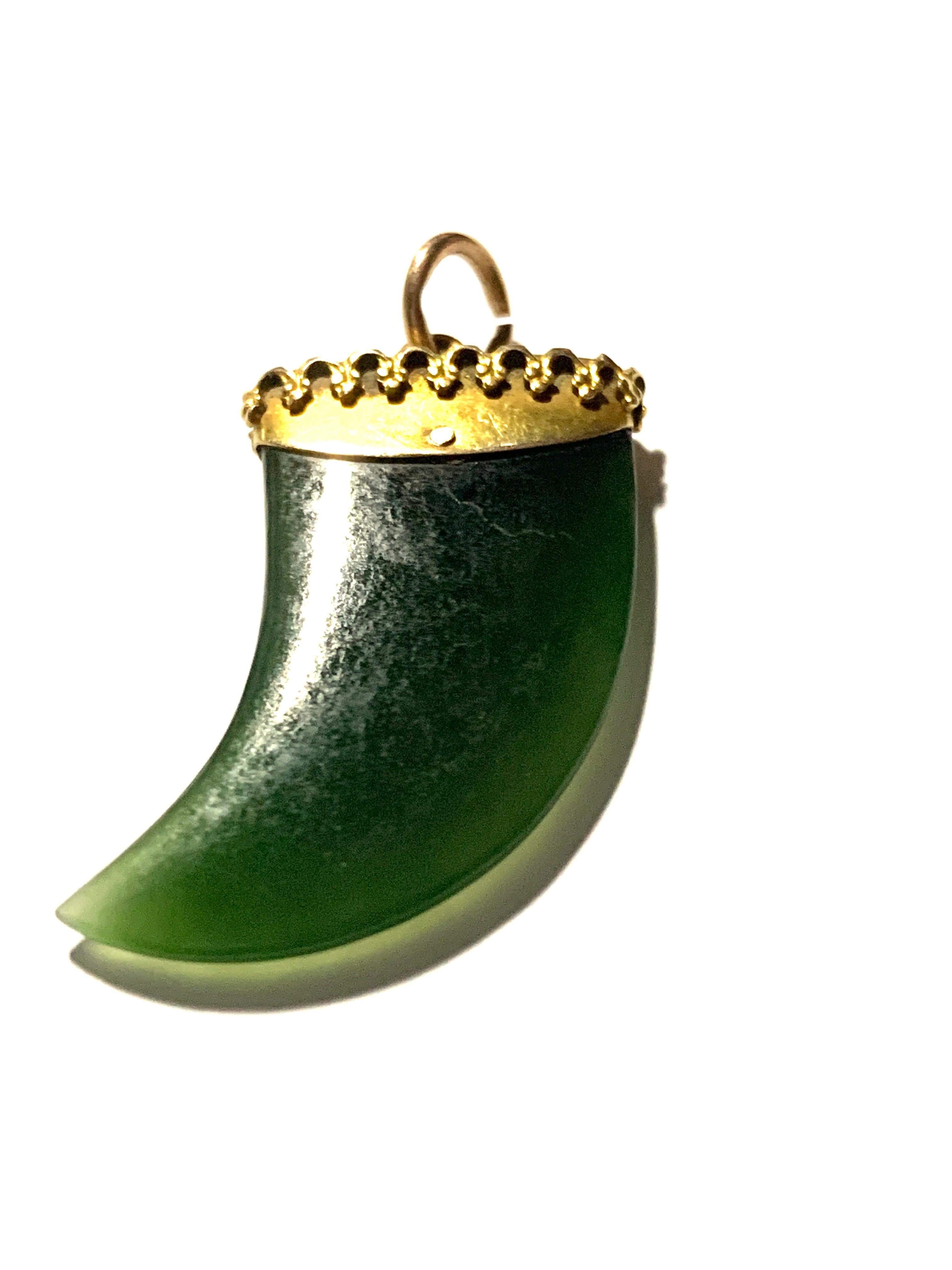 jade tooth pendant