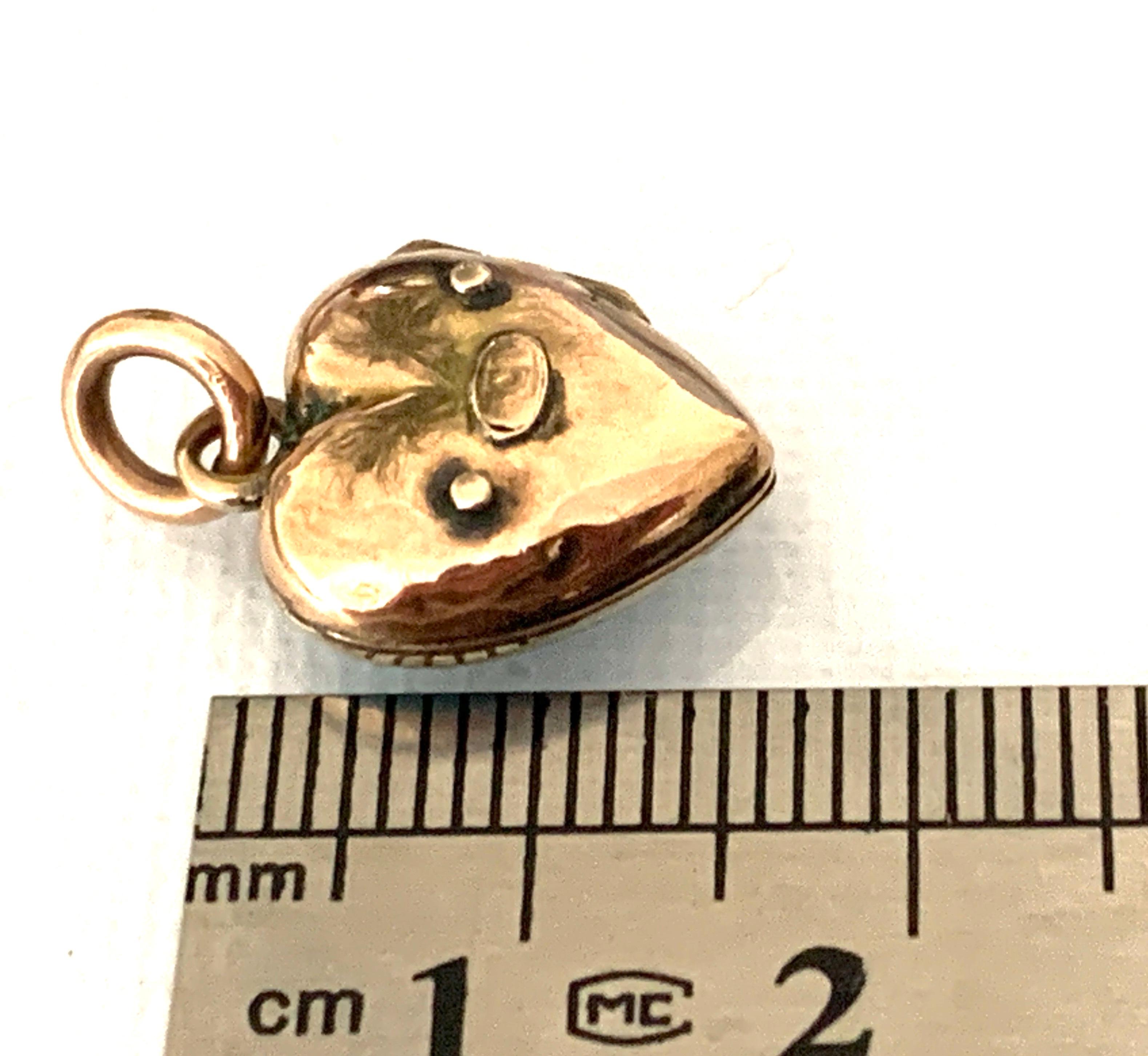 Antique
Circa 1880s.
Turquoise semi precious gemstone fronted 
9ct gold Locket

with faded 9ct on raised plaque section to lockets reverse
Closure very good
Bail ring is in great condition too
Very Pretty piece of Victorian jewellery
Size 1.5 cm x