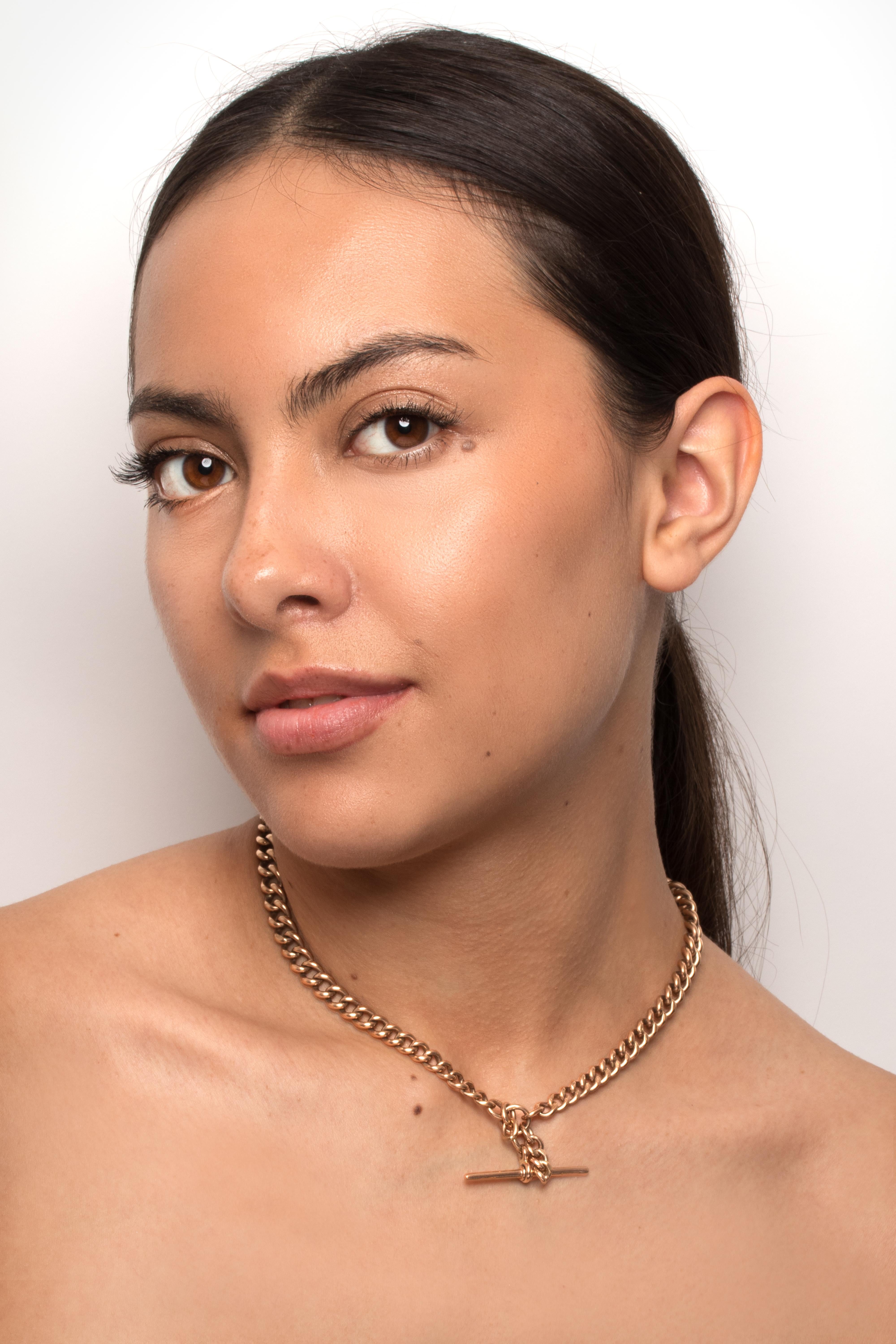 This Albert chain dates back to the 1900s. Crafted from 9 carat rose gold each of the graduating links is individually hallmarked. This lovely Victorian piece is 16 inches long and ends in a T bar. The chain weighs a total of 49.2 grams.

Age: