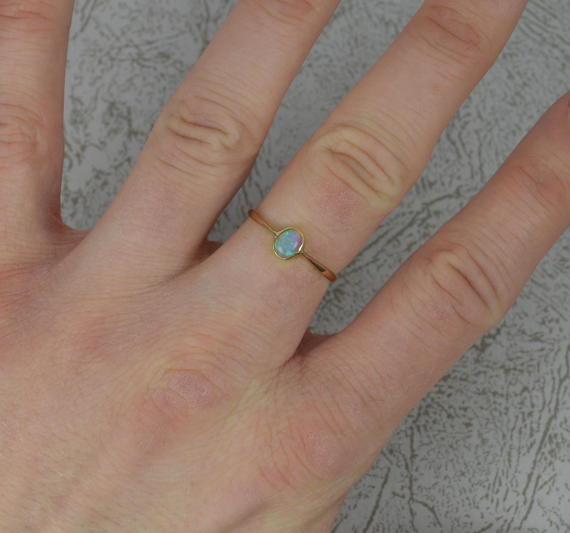 A fine opal and 9ct gold solitaire ring.
Solid 9 carat rose gold example.
Oval opal in fine multi bezel setting.
4.3mm x 5.4mm stone.
Circa 1890.
Full of colour.

CONDITION ; Excellent. Well set stone, issue free. Clean and solid band. Please view