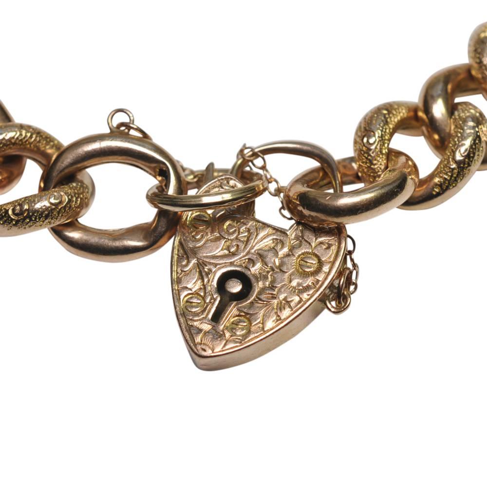Beautiful Victorian ornate 9ct gold curb link bracelet; this is one of the best bracelets of this type we have ever had and is in a rich, warm rose gold.  Alternate links are carved and polished and the padlock is engraved with a floral pattern.  In