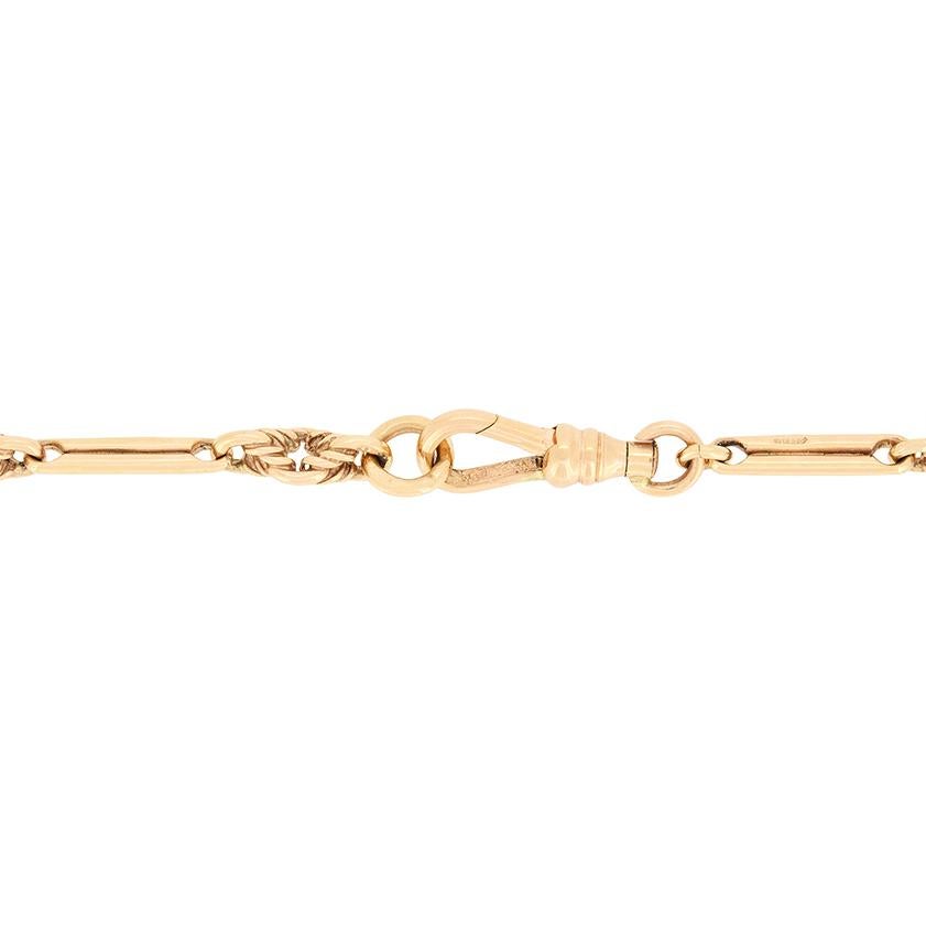 This rare Victorian Albert chain is crafted from solid 9 carat rose gold. With alternating links of intricate trombone and woven links to create the 24