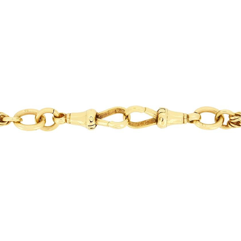 Crafted in 9ct yellow gold, this albert chain dates to the turn of the 20th century. Weighing 40 grams this solid gold chain is 21″ long and features elongated trombone links amidst the regular chain links.  Albert chains are a wonderful piece of