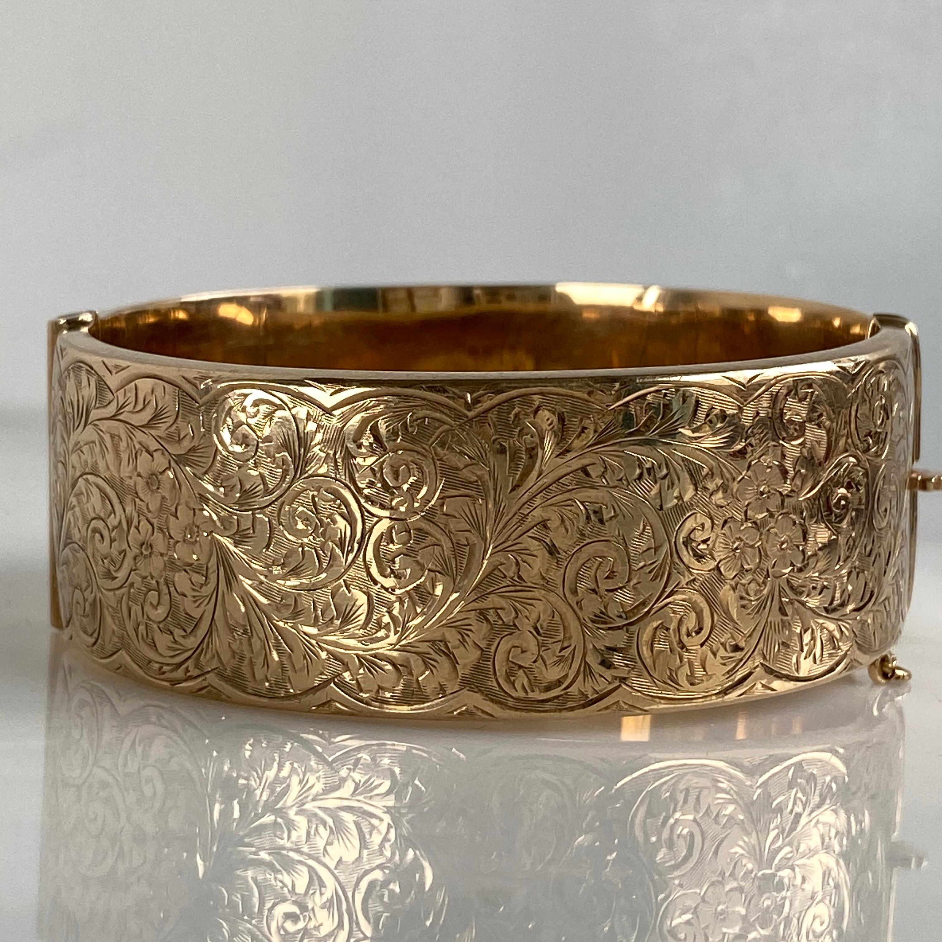 Details:
Sweet Victorian 9K gold bracelet. Lovely delicate floral engraving pattern along the front, smooth rose gold back. It has a very secure clasp. The bracelet opens wide and freely which makes it very easy to put on and wear. There are