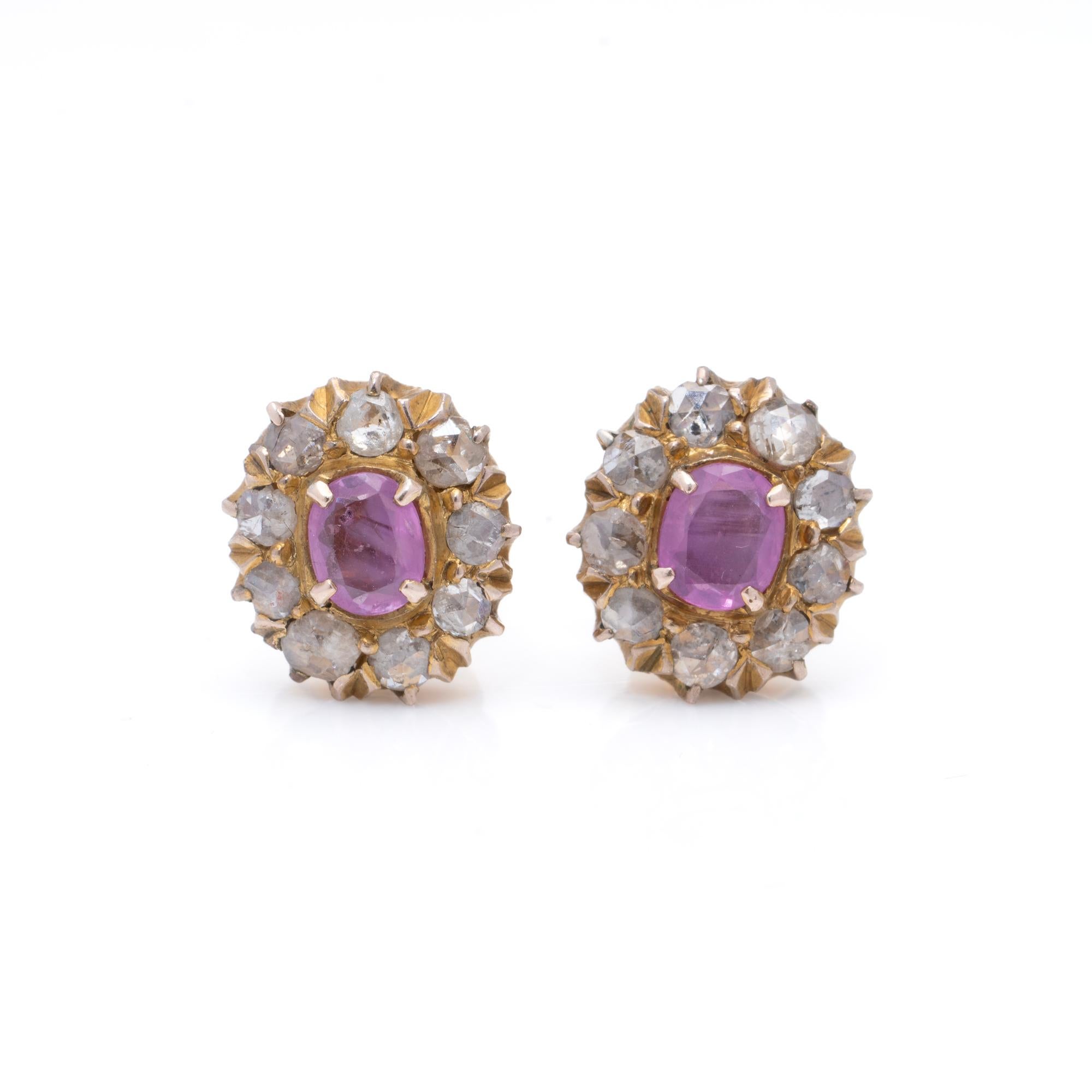 Victorian 9K Gold Pink Sapphire and Rose-Cut Diamond Screw-Back Earrings (Circa 1880s)

These elegant Victorian earrings, crafted in 9K gold, feature a classic cluster design with vibrant pink sapphires at the centre, surrounded by sparkling
