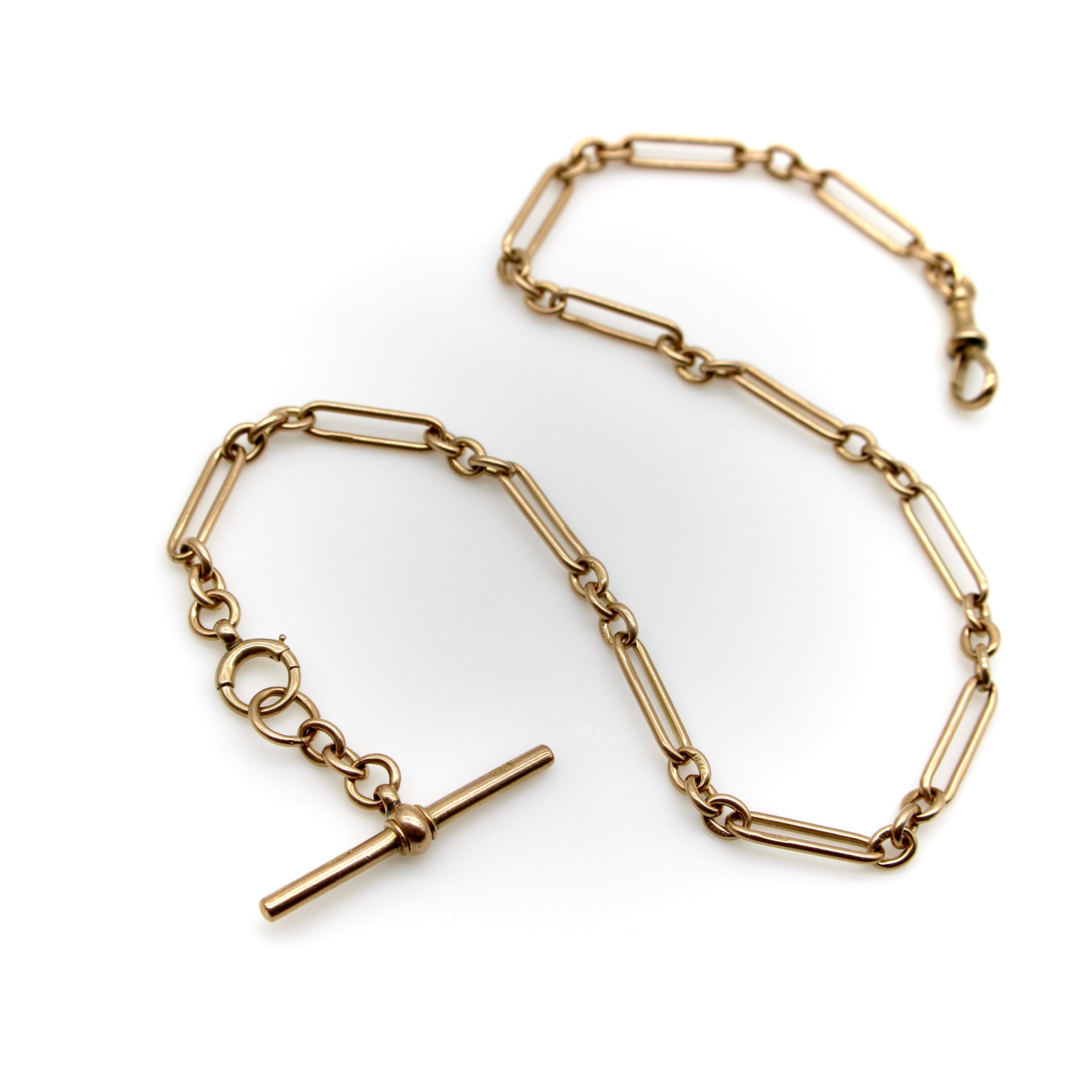 This 9k gold Victorian watch chain consists of trombone links connected by sections of three oval links in a beautiful alternating pattern. The chain comes with a removable T-bar that’s clipped into the dog clip and spring ring, making this a very