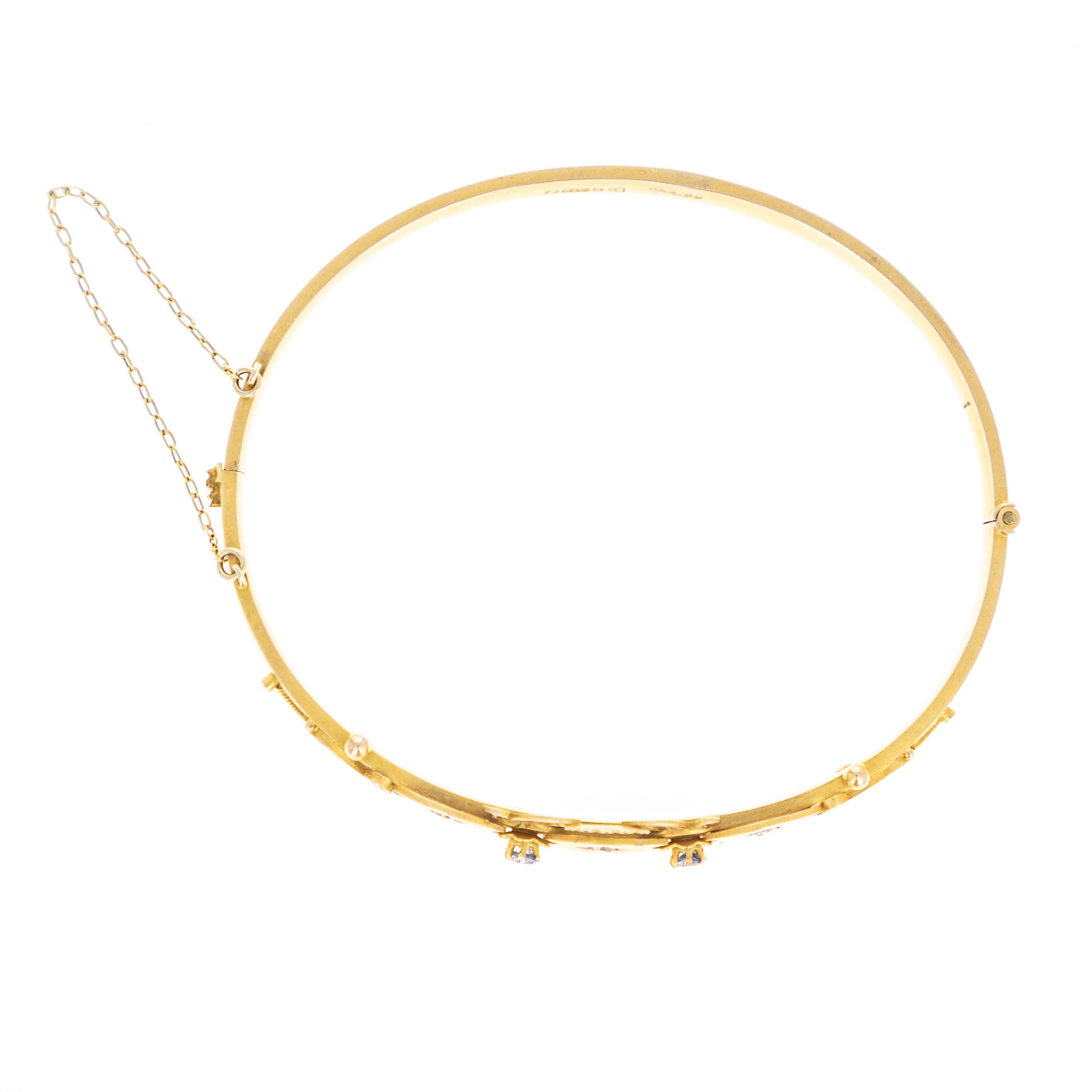 Era: Victorian Estate
Composition: 9K Yellow Gold 
Primary Stone: Three Rose Cut Diamonds
Total Carat Weight: Approximately 0.08 Carats
Color/Clarity: K-L / SI1-2
Accent Stones: Two Natural Sapphires
Total Carat Weight: 0.10 Carats
Bracelet