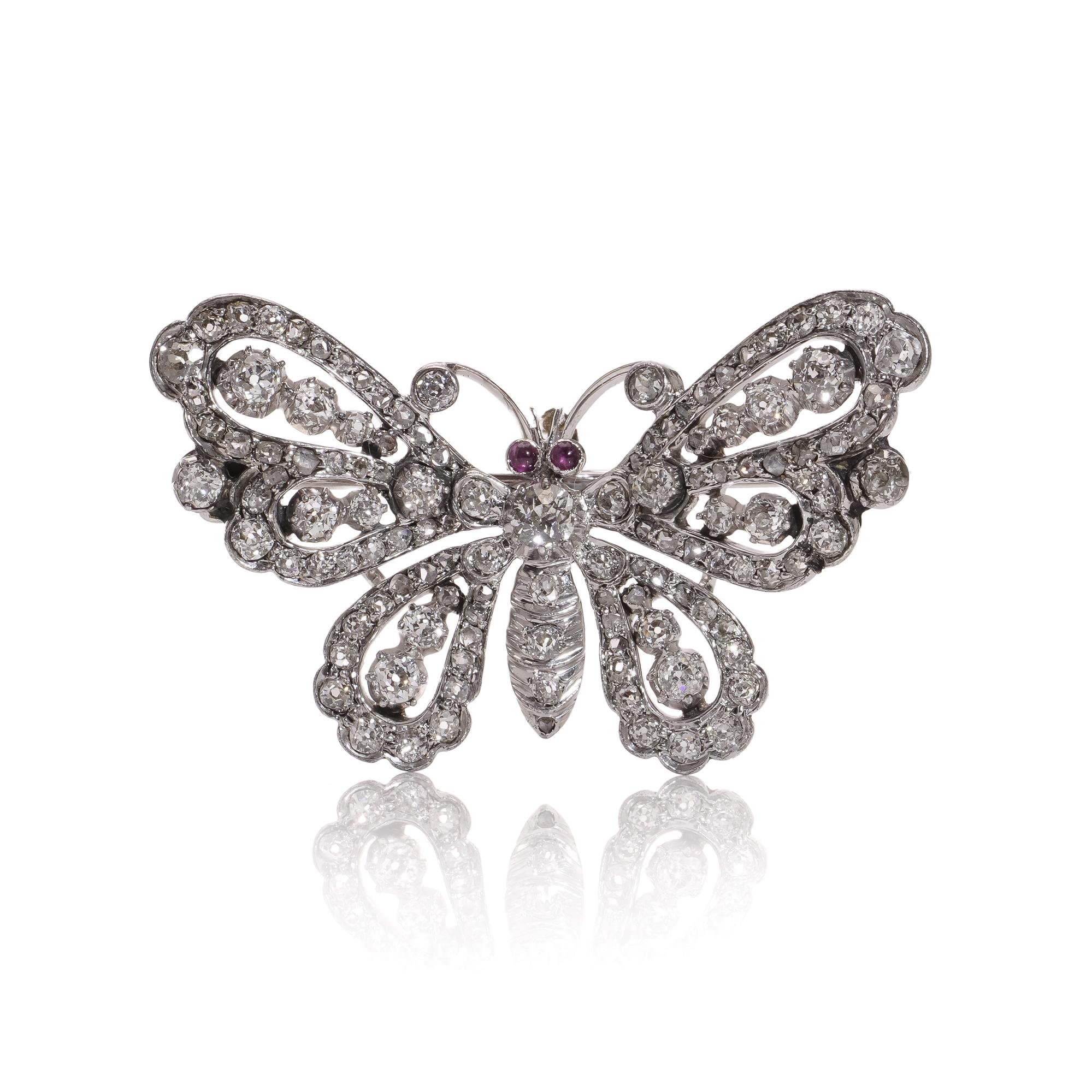 Antique Victorian 9kt white gold and silver butterfly brooch with old cut diamonds rubies.
Made in England, Circa 1890s.
X-ray tested positive for 9kt gold and silver.

The dimensions -
Size: 3.9 x 2.5 cm
Weight : 7.00 grams

Rubies -
Cut: Round