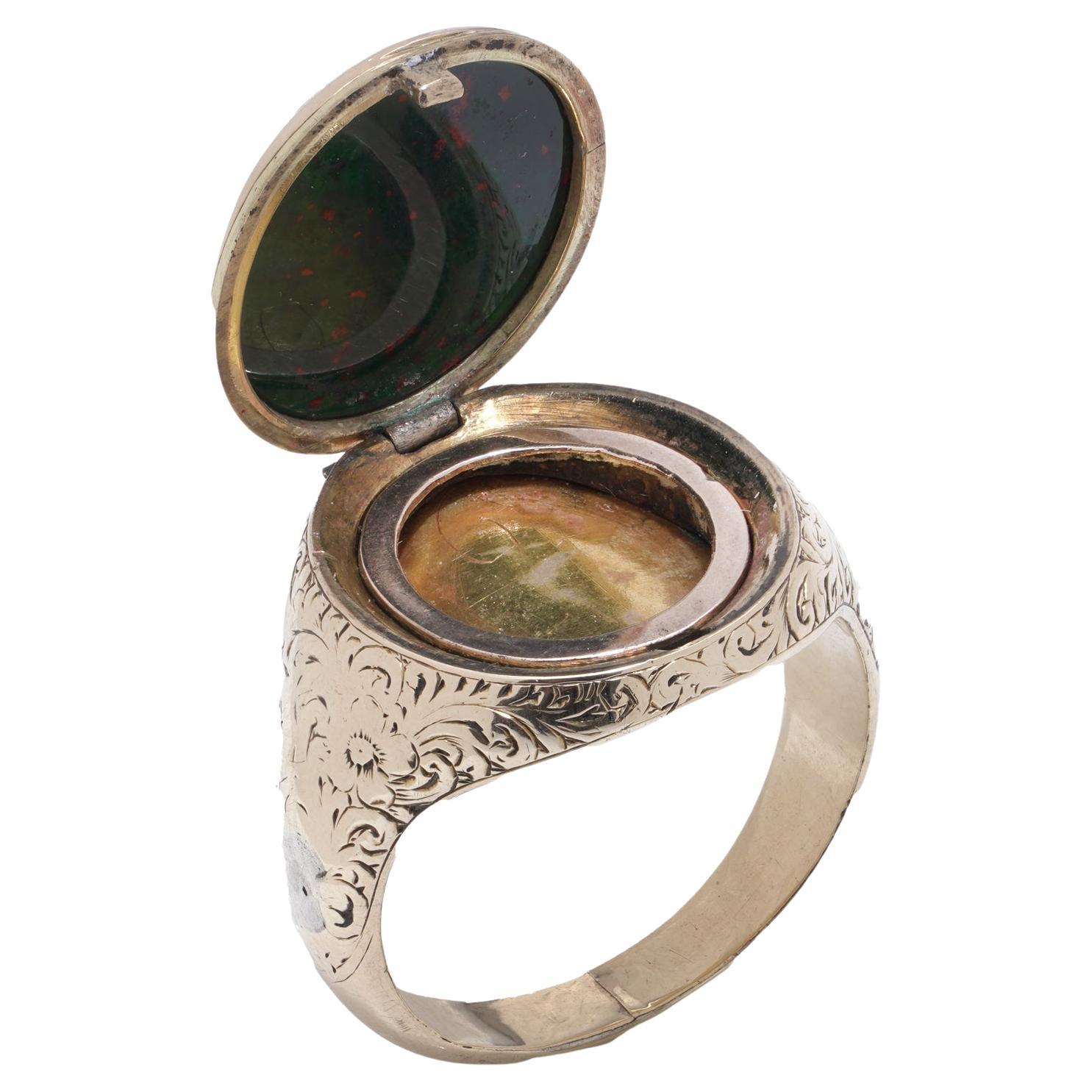 VICTORIAN 9KT GOLD BLOODSTONE SIGNET RING WITH OPENING COMPARTMENT, CIRCA 1880s