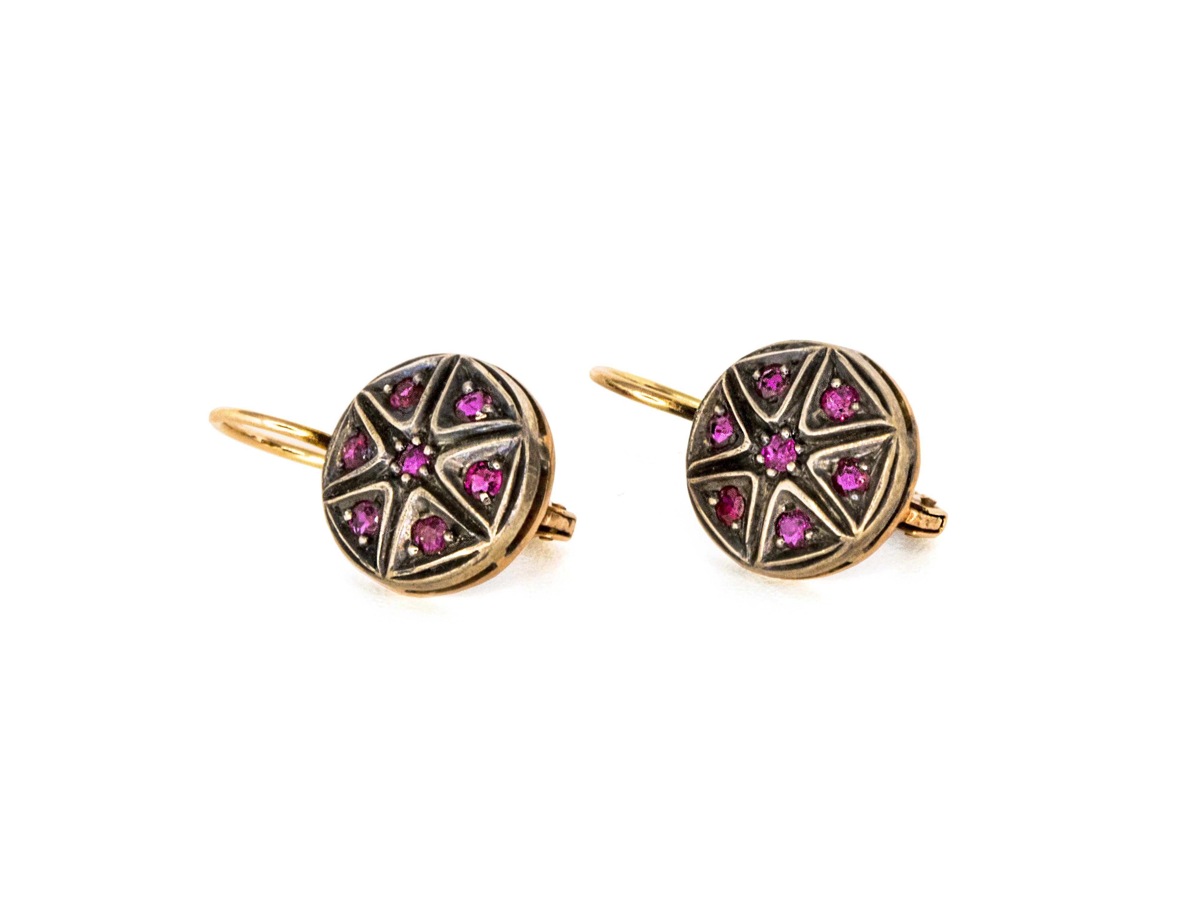 These Victorian era inspiration pair of earrings are crafted in 9 Kt pink gold and topped in sterling silver.
They feature 14brilliant cut Rubies which gave a star pattern design.
The combination of colors gives to these earrings a particular retro