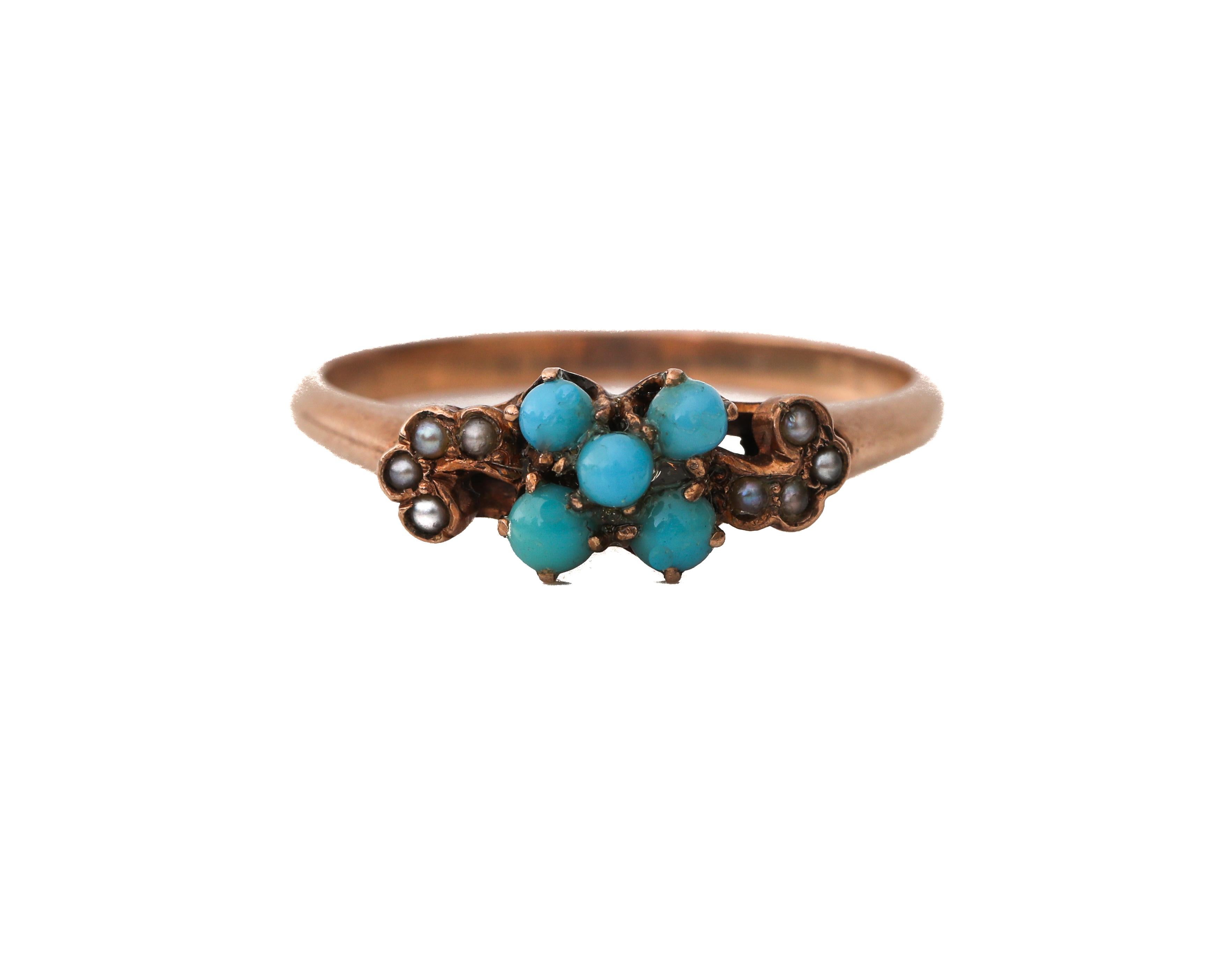 Description: 
This piece is a genuine 1800's Victorian beauty! An excellent example of a victorian petite ring featuring an asymmetrical design pattern swirl on both sides of the turquoise center cluster. Small turquoise cabs and seed pearls give a