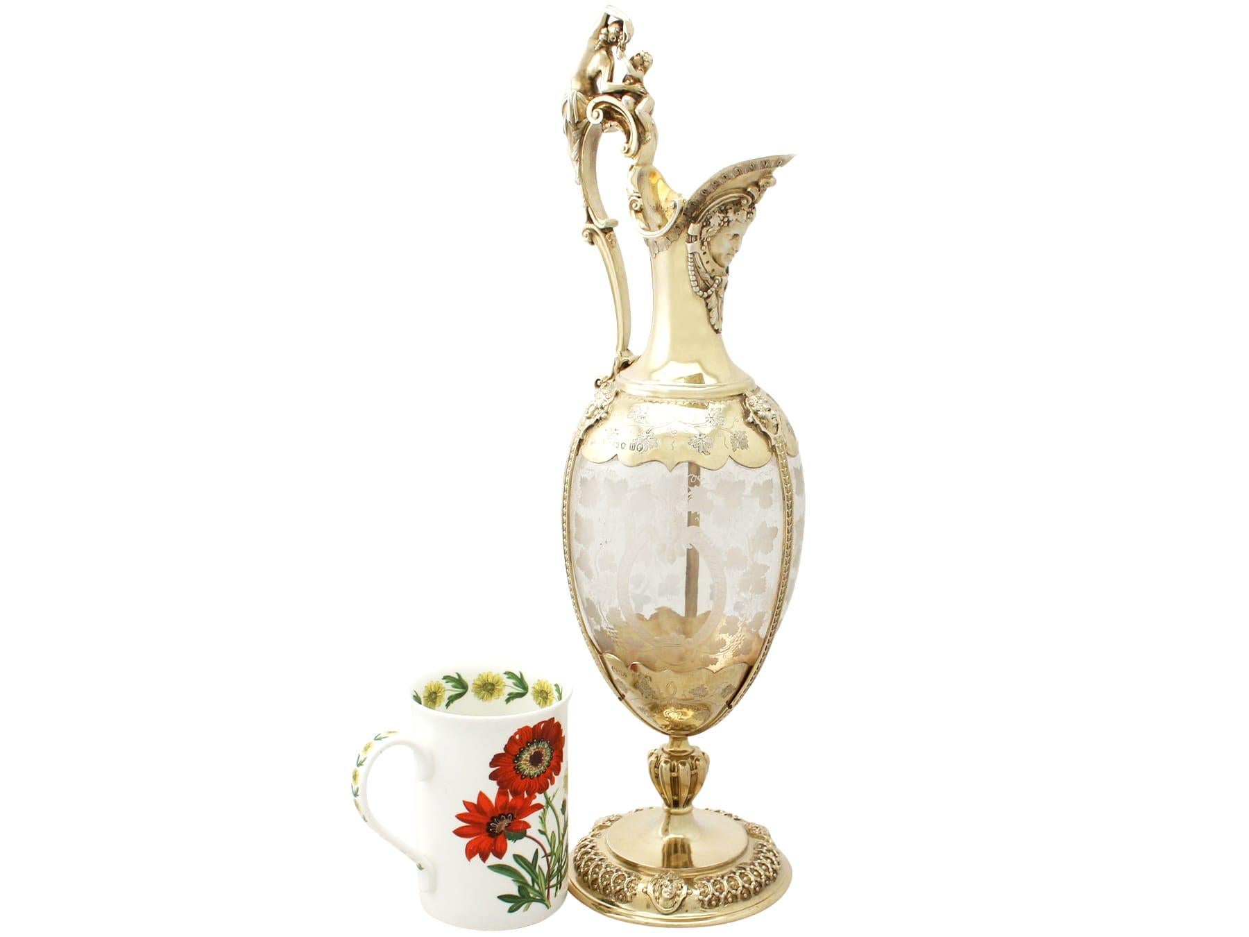 A magnificent, fine and impressive antique Victorian English acid etched glass and sterling silver gilt claret jug; an addition to our wine and drinks related silverware collection.

This magnificent antique Victorian glass and sterling silver