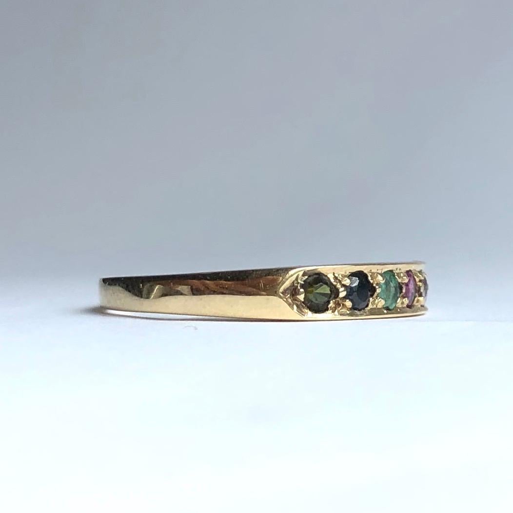 This ring spells out Dearest using the first letters of the stones. Diamond, Emerald, Amethyst, Ruby, Emerald, Sapphire, Tourmaline. The stones are modelled set within a 9carat gold band and is made in London, England. 

Ring Size: N 1/2 or 7 
Band