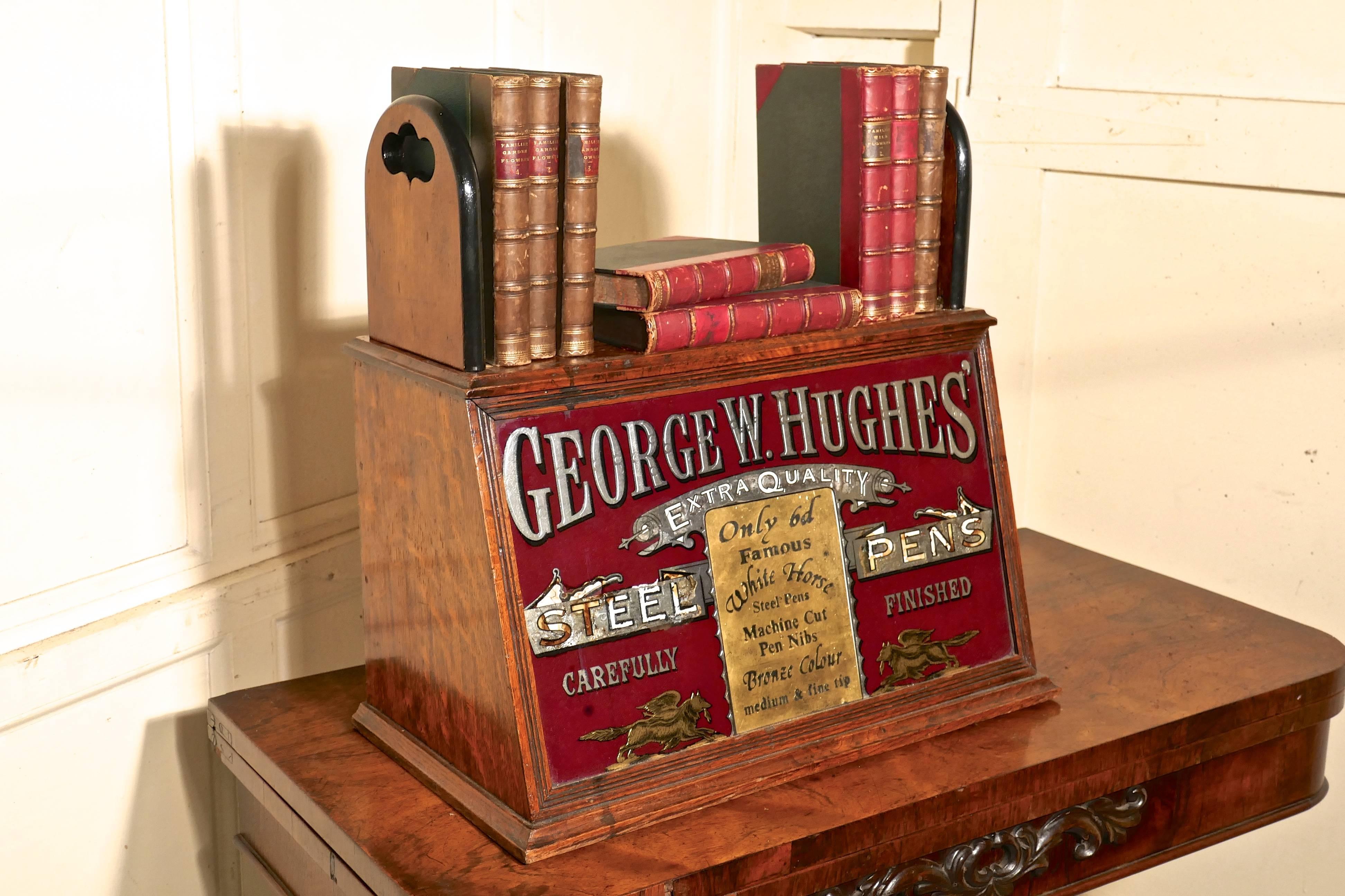 Victorian advertising stationers cupboard, shop display pen cabinet.

A lovely piece of Victorian shop display, a bespoke oak cupboard is from George W Hughes pen maker, advertising steel pens.
The cabinet has on the front a sign written, gilded and