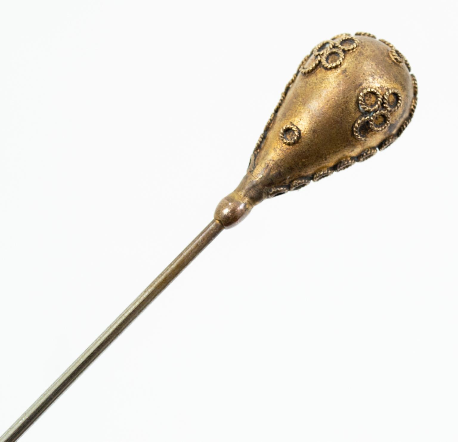 A necessity during the Victorian Era, hat pins not only balanced precarious hats atop piles of hair but also moonlighted as weapons against overzealous gentlemen. Though teetering hats are no longer de rigeur, glorious century-plus-old pins such as