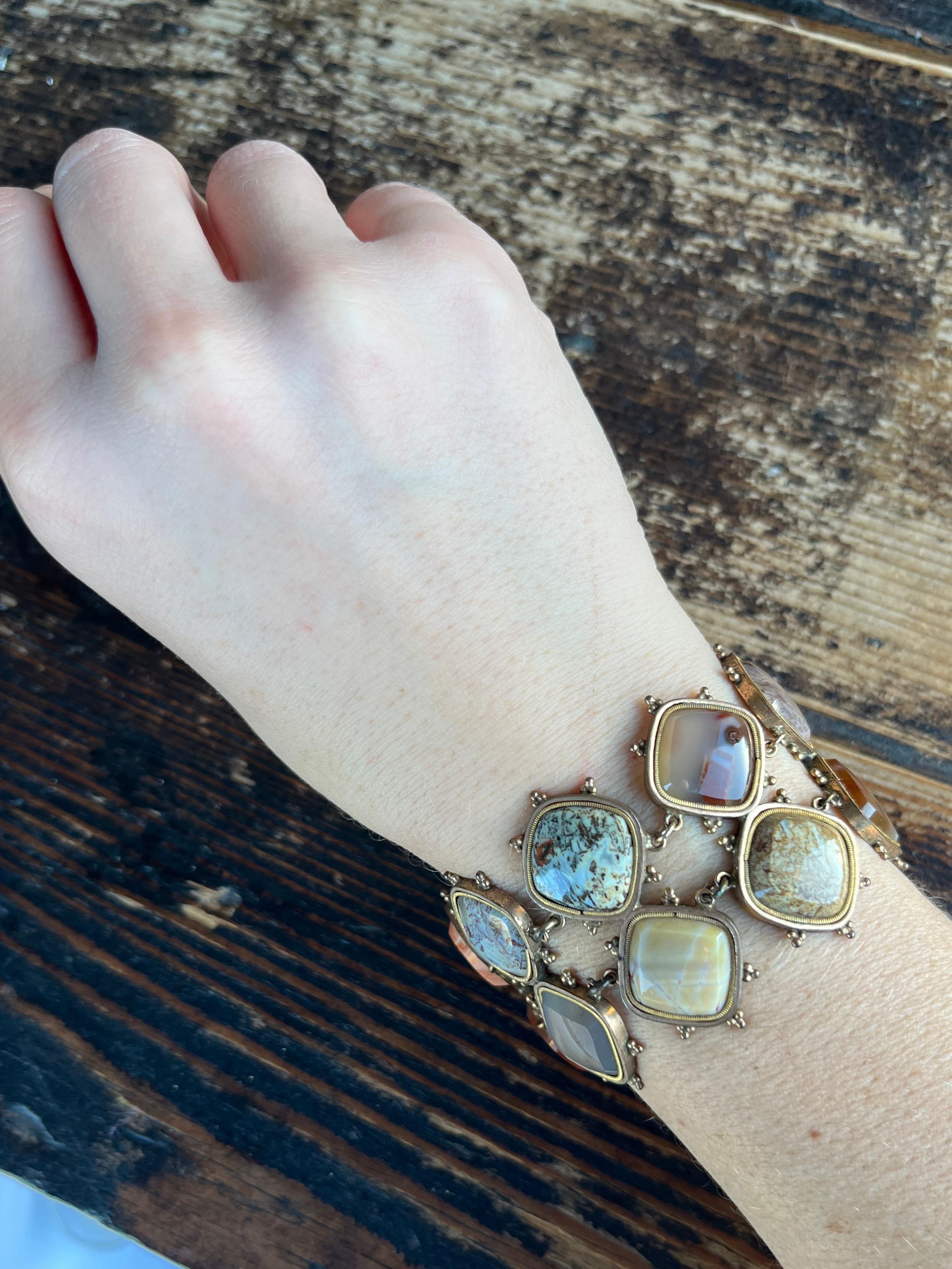 This gorgeous bracelet holds so much colour. The settings are both simple and dome have fine engraving. The bracelet is fastened using a simple bolt clasp. 

Length: 17cm
Width: 4cm

Weight: 33.7g 