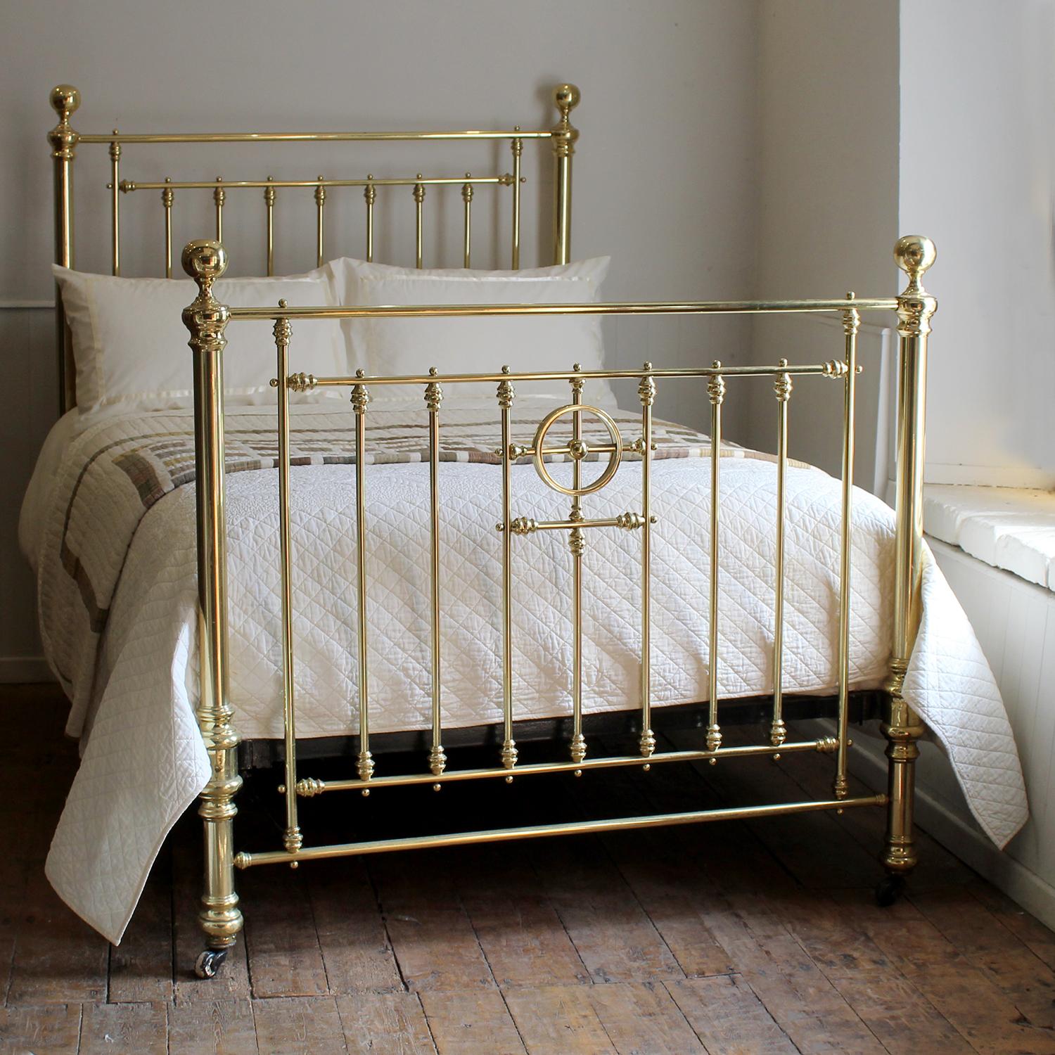 A fine example of a Victorian all brass bed in the double size, circa 1890 with substantial side posts, large spherical brass knobs, decorative fittings and central ring feature in the foot board.

This bed will accept a Double Size 54 inch wide