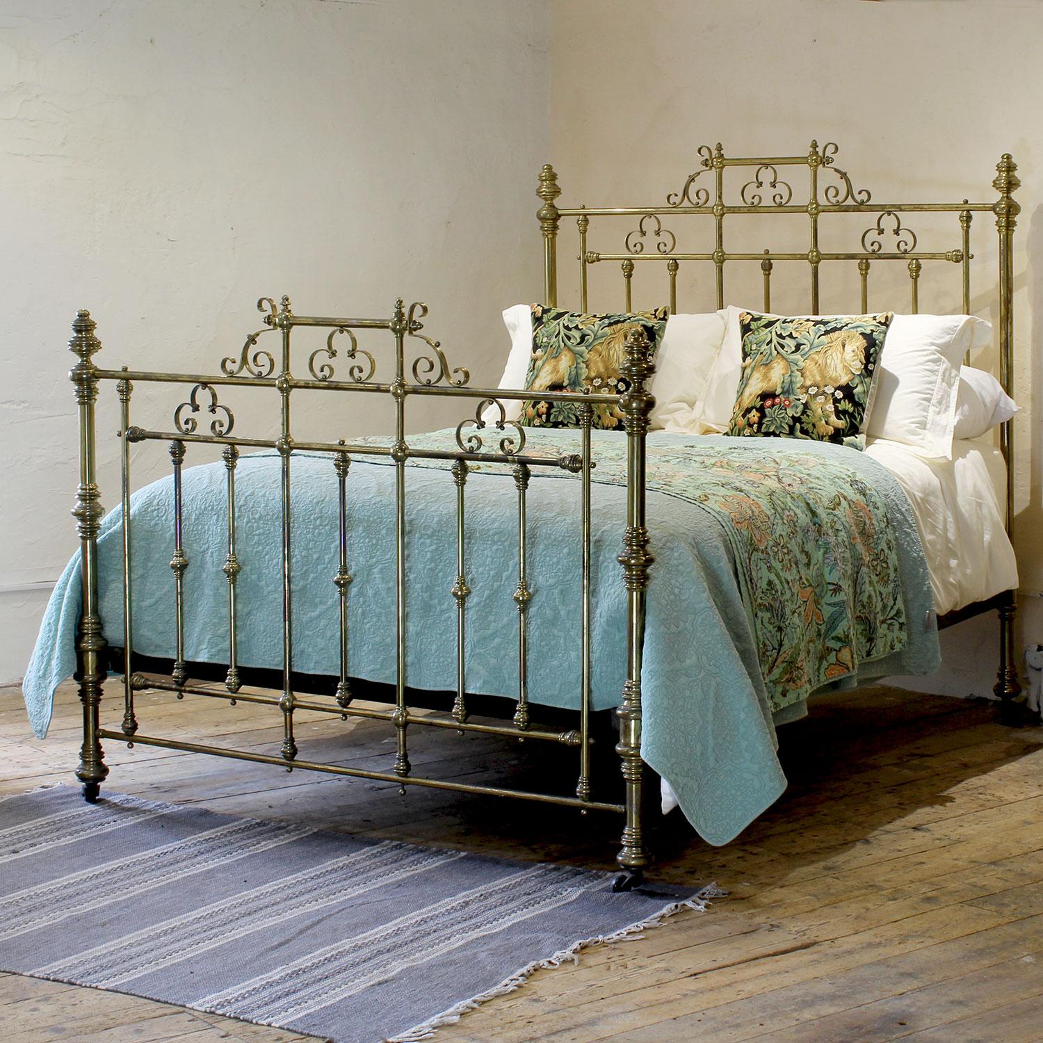 A magnificent top quality all brass Victorian antique bed with matching decorative gallery in head and foot panels, ornate brass knobs and scroll decoration.
This bed has the original patina of 150 years, but we can repolish and lacquer if required.