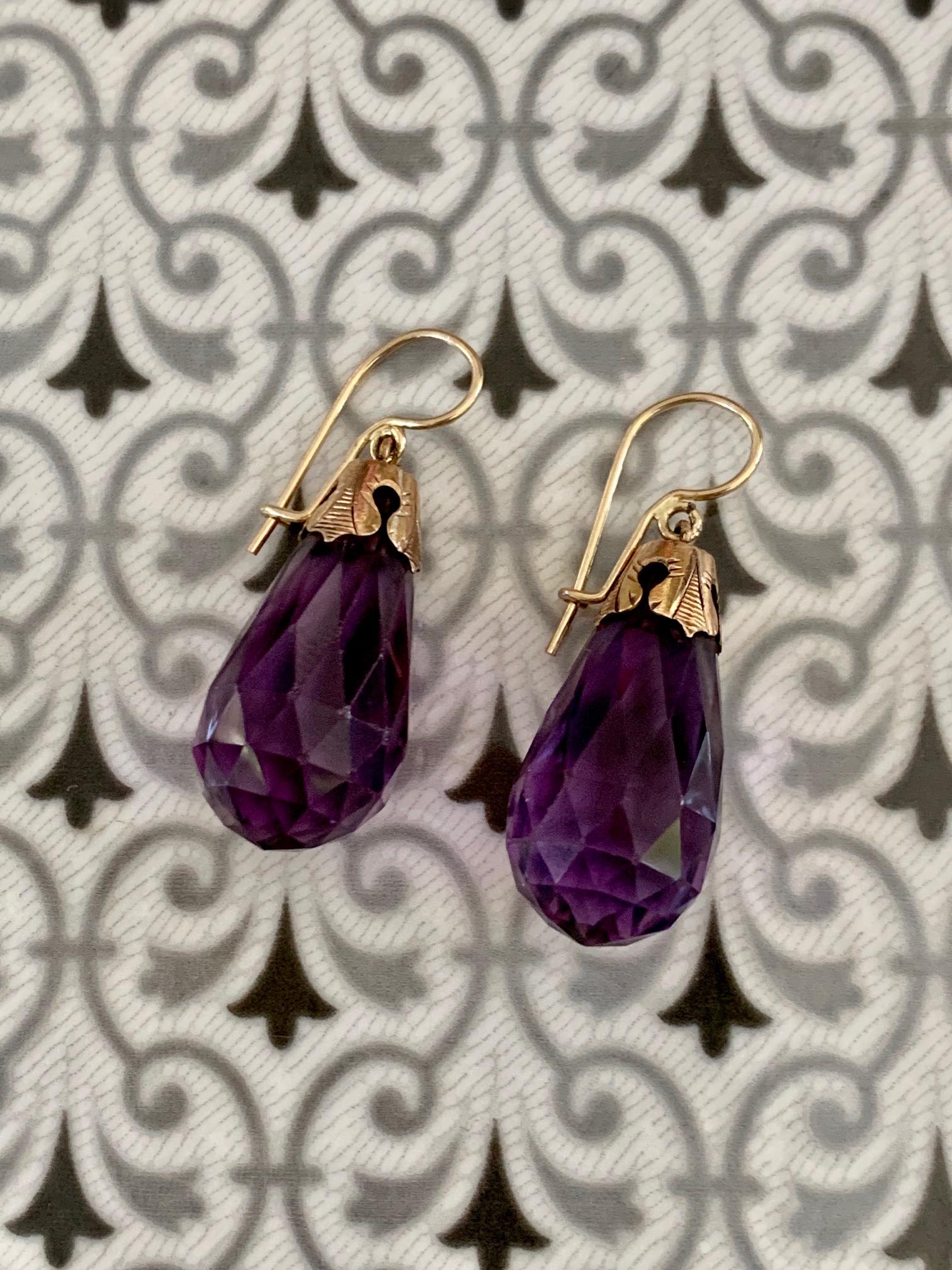 These tear drop, faceted Amethyst drop earrings are perfect for anyone, but especially the February birthday gal!  These are simple, but oh so beautiful.   The multiple facets reflect light from every angle.  
The Amethyst stones are held in place