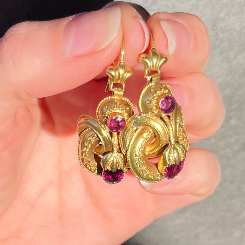 These earrings hold so much delicate detail. The gold is sculpted into textured swirls and rope twists. The main event is the pretty amethyst stones. Stone total for earrings 2ct.

Earring Dimensions: 35x18mm

Weight: 5.7g


