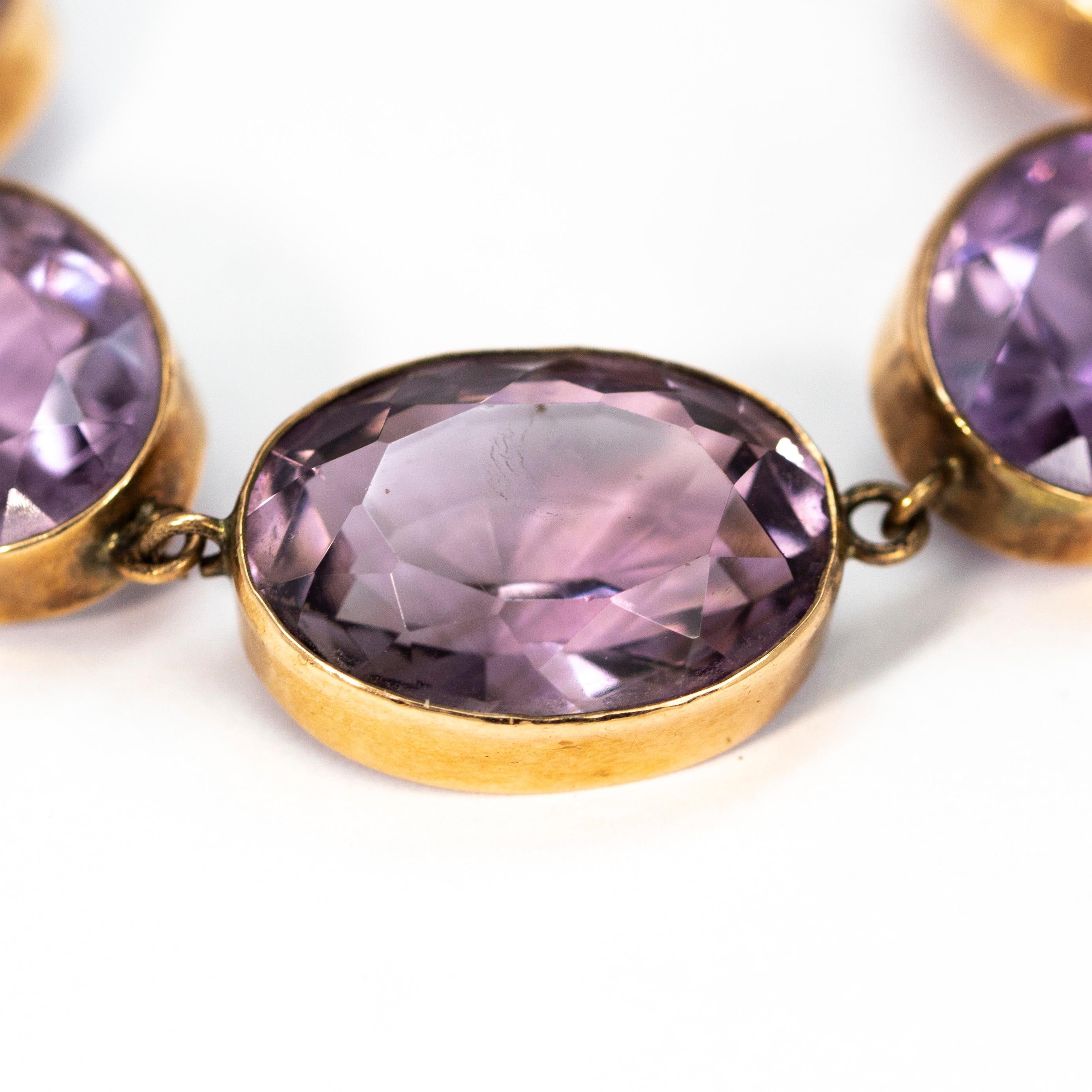 The amethyst stone are a pale purple colour which sit beautifully with the yellow gold simple settings. The stones slightly graduate in size from the centre of the necklace to the fastening. 

Length: 15 1/2 inches 
Stone Dimensions From 15 x 20mm