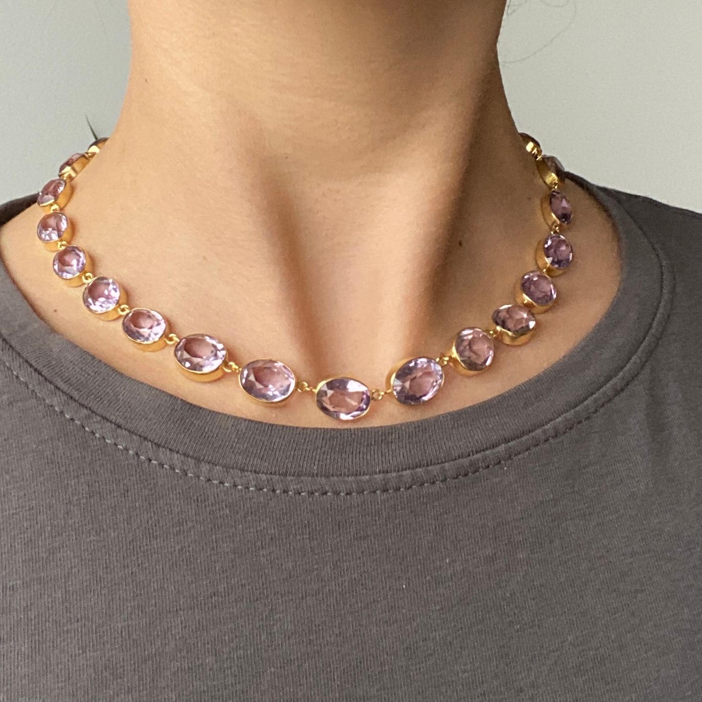 The amethyst stone are a pale purple colour which sit beautifully with the silver gilt simple settings. The stones slightly graduate in size from the centre of the necklace to the fastening. 

Length: 40cm 
Stone Dimensions: 10x13mm - 8x6mm

Weight: