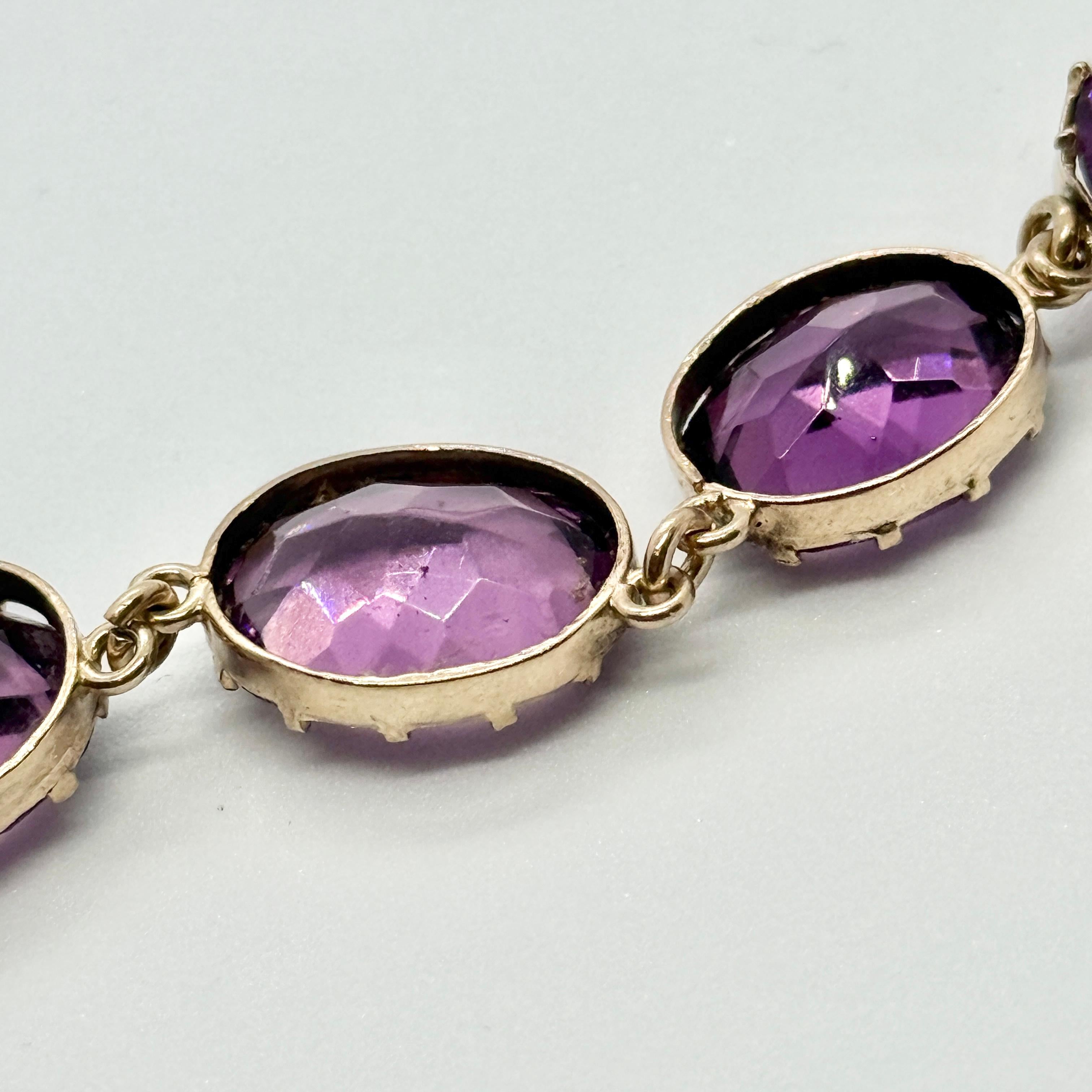 The amethyst stone are a rich purple colour which sit beautifully with the silver gilt simple settings. The stones slightly graduate in size from the centre of the necklace to the fastening. 

Length: 43.5cm 
Stone Dimensions: 15x11mm -