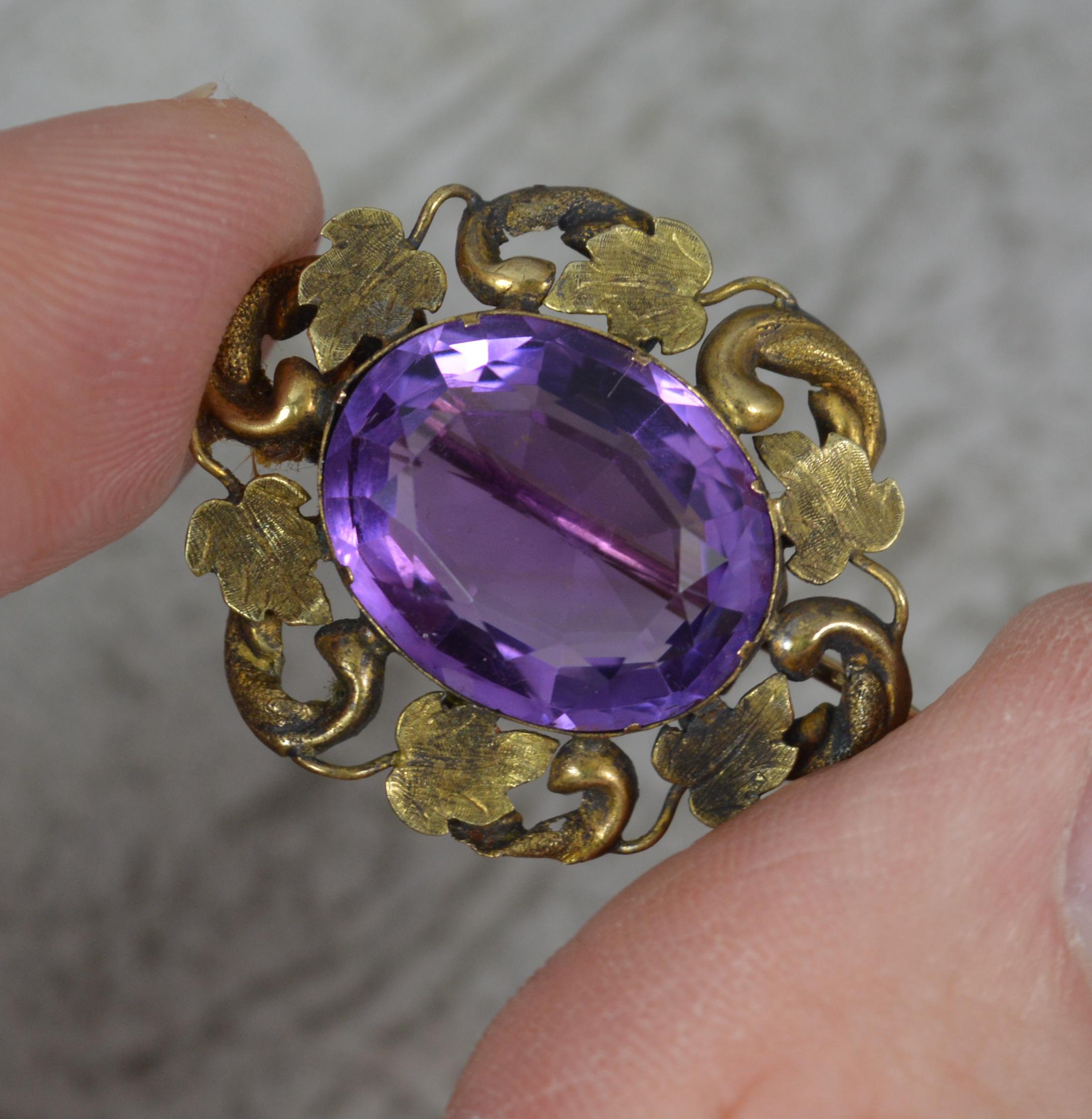Oval Cut Victorian Amethyst and Yellow Gold Floral Brooch, c1860
