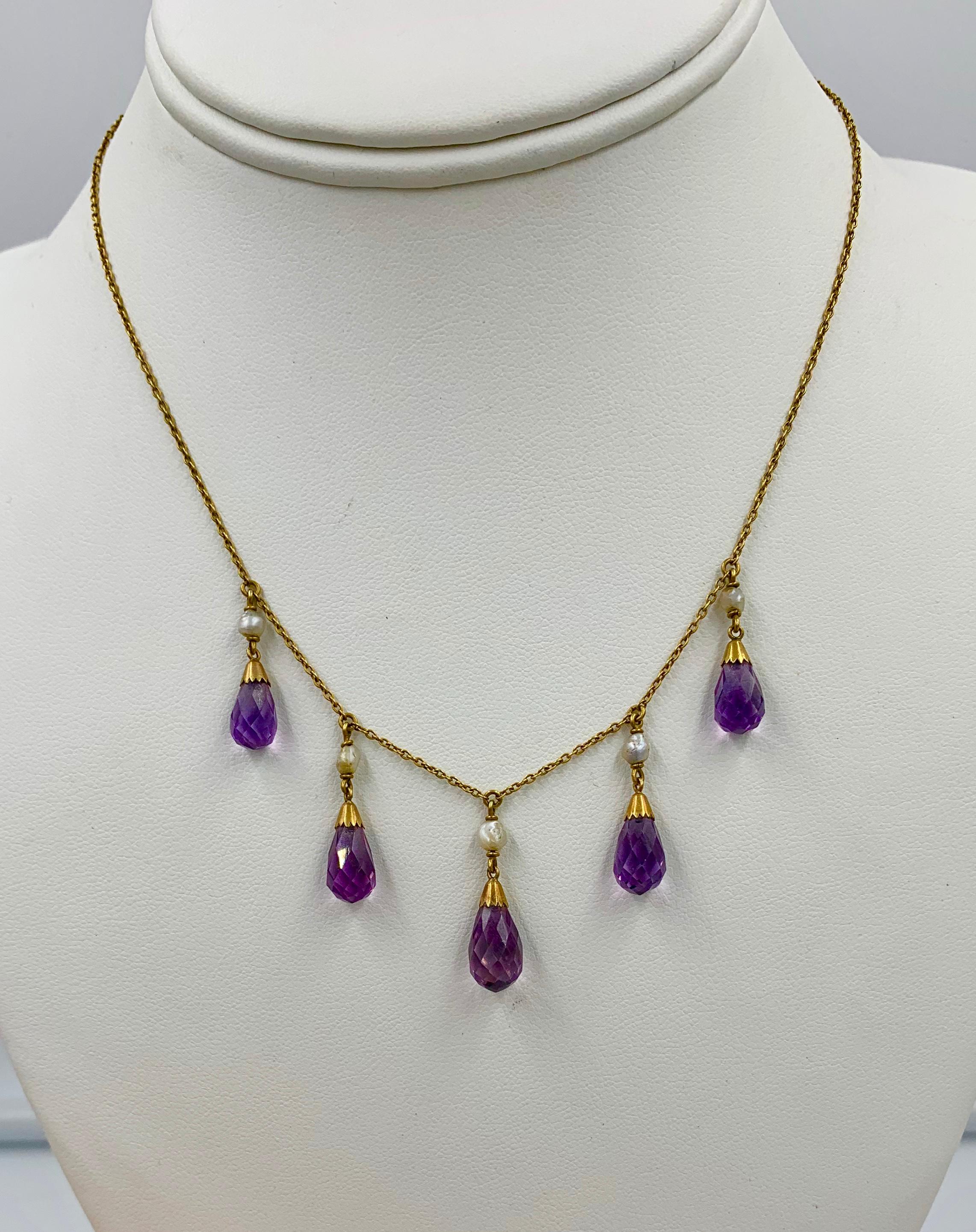 A stunning Victorian - Belle Epoque Amethyst Necklace with 5 gorgeous graduated Briolette Cut Amethysts set in a perfect 14 Karat Yellow Gold Necklace.  The Amethysts have the most wonderful purple color and the briolette cut of the gems brings out
