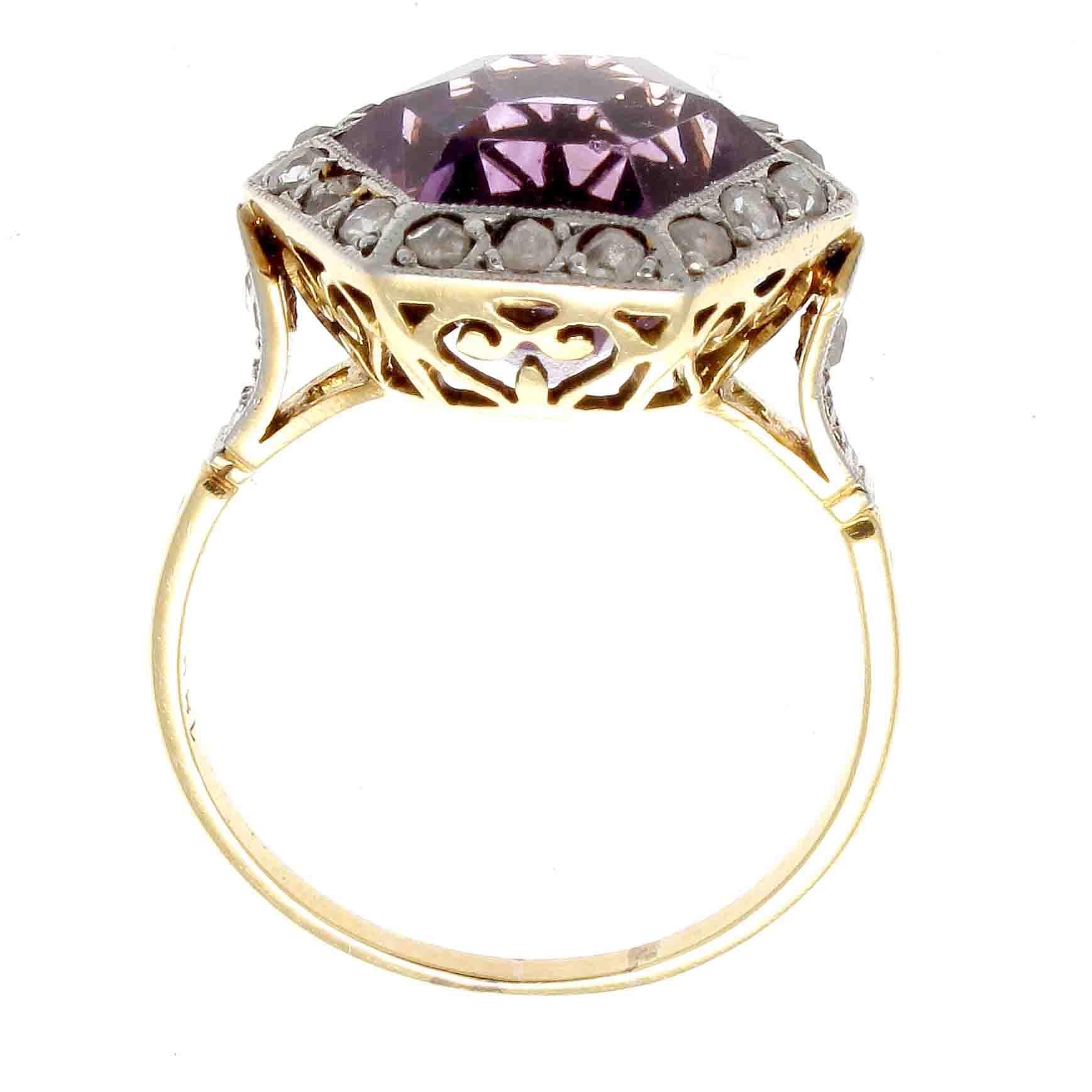 The Victorian era is a time of change, experiments and revolutionary style changes. This 19th century creation features a vibrant purple hexagonal amethyst outlined by rows by rose cut diamonds. Hand crafted in 18k yellow gold and platinum.   

Ring